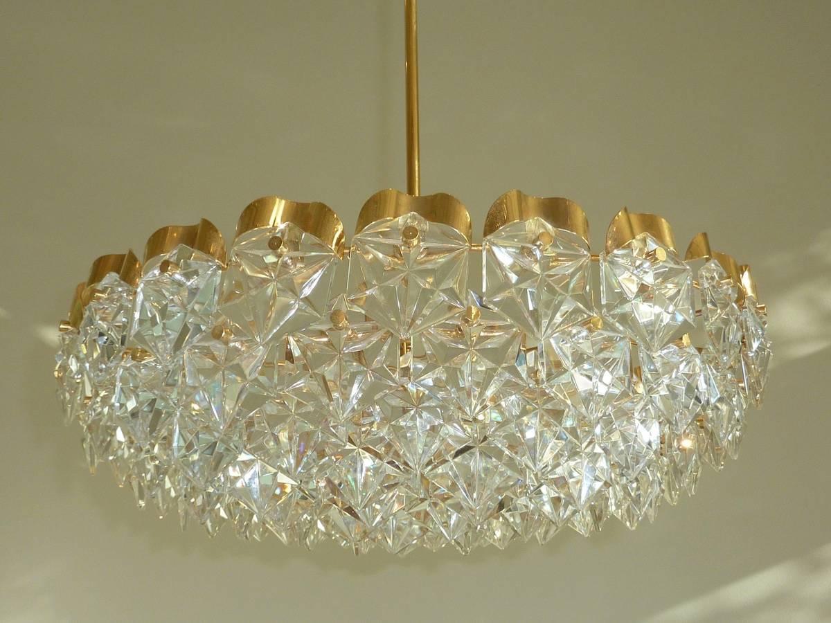 Faceted hexagonal crystal chandelier with brass hardware made by German maker, Kinkeldey. Simplistic beauty reflected in its crystal lighting.