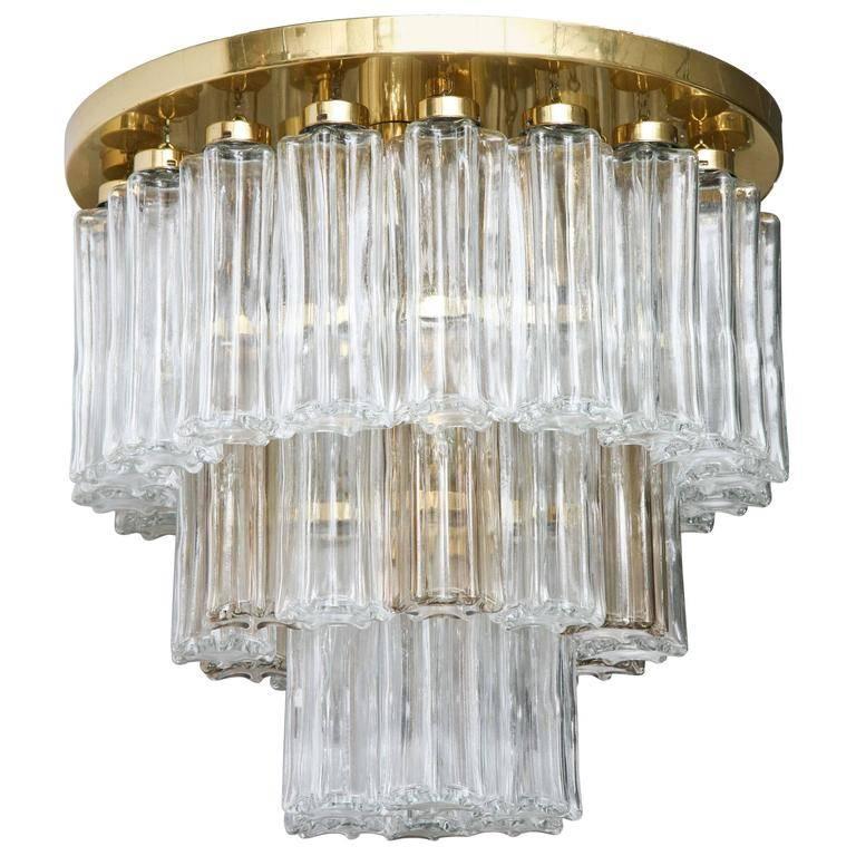 This unique “Glashuette Limburg” three-tier brass and glass 1970s chandelier from Germany contains four electrical sockets designed for European style bulbs.