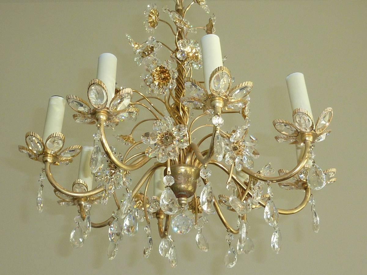 Beautiful chandelier crystal flowers made by the German company Palwa. The Fixture has eight European style E14 sockets. It requires eight European E14 candelabra bulbs.