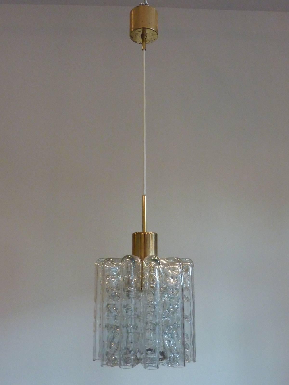 Beautiful pair of organic glass tube ceiling light pendants with brass hardware. Made by Doria Leuchten, Germany in the 1970s. Each has one E27 European Socket.
