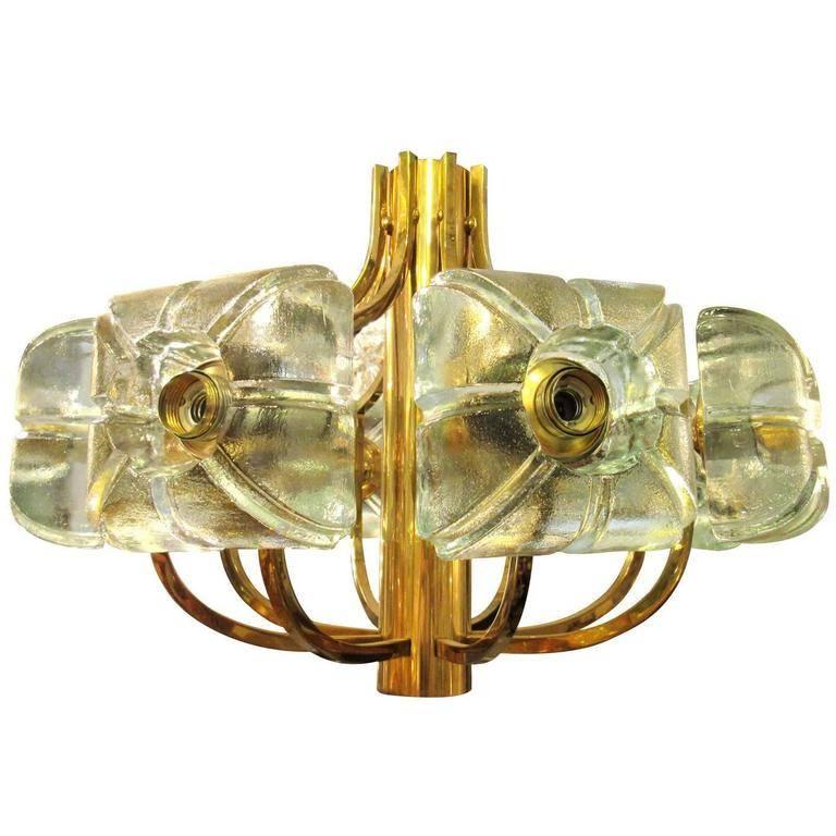 Vintage Kalmar chandelier with brass hardware and thick glass cubes that radiate around the circumference. There are eight sockets in total.