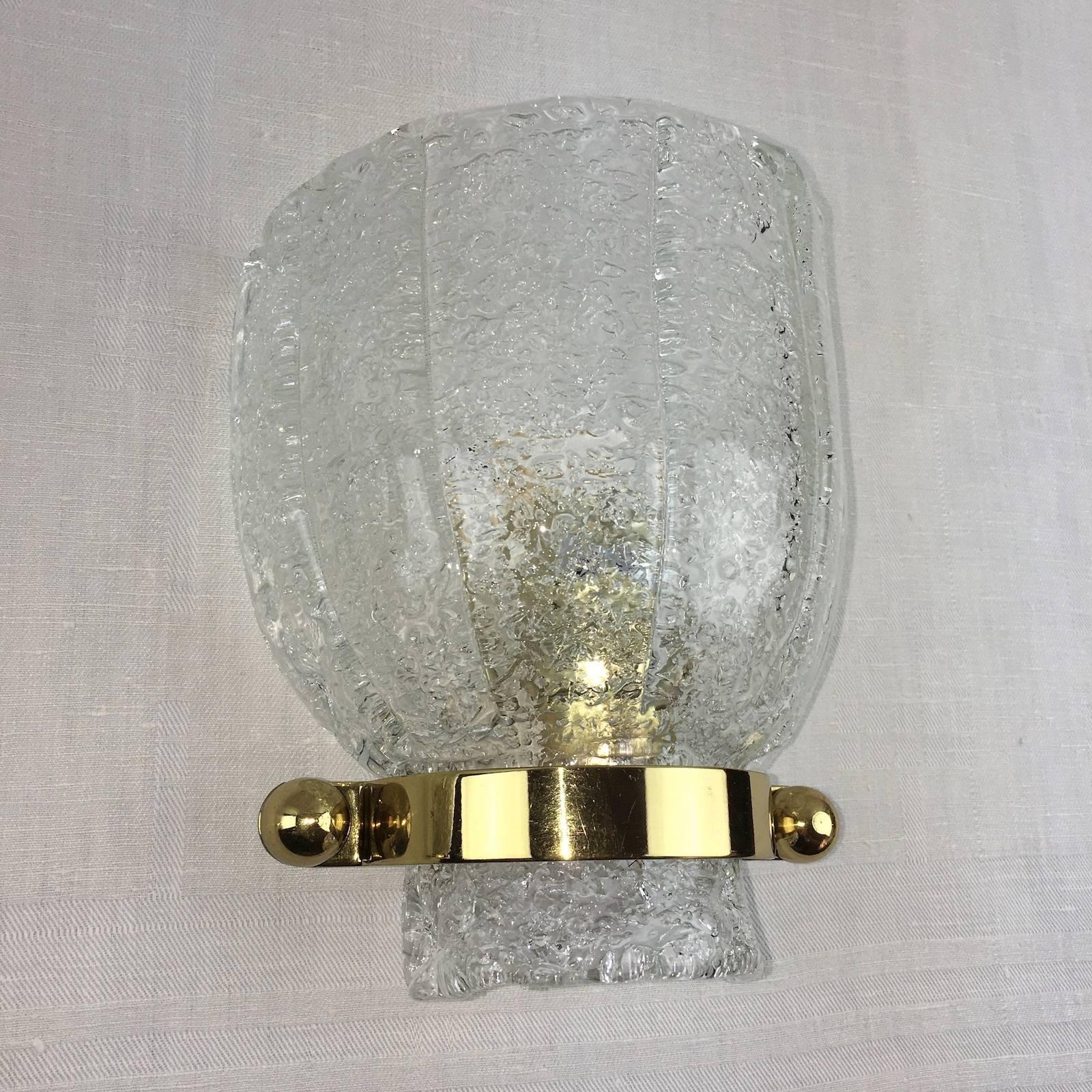 A pair of 1960s Calyx form sconces, made by Hillebrand, in textured glass, holder with a polished brass and metal frame. Each fixture requires one European E27 Edison bulb, each bulb up to 60 watts.