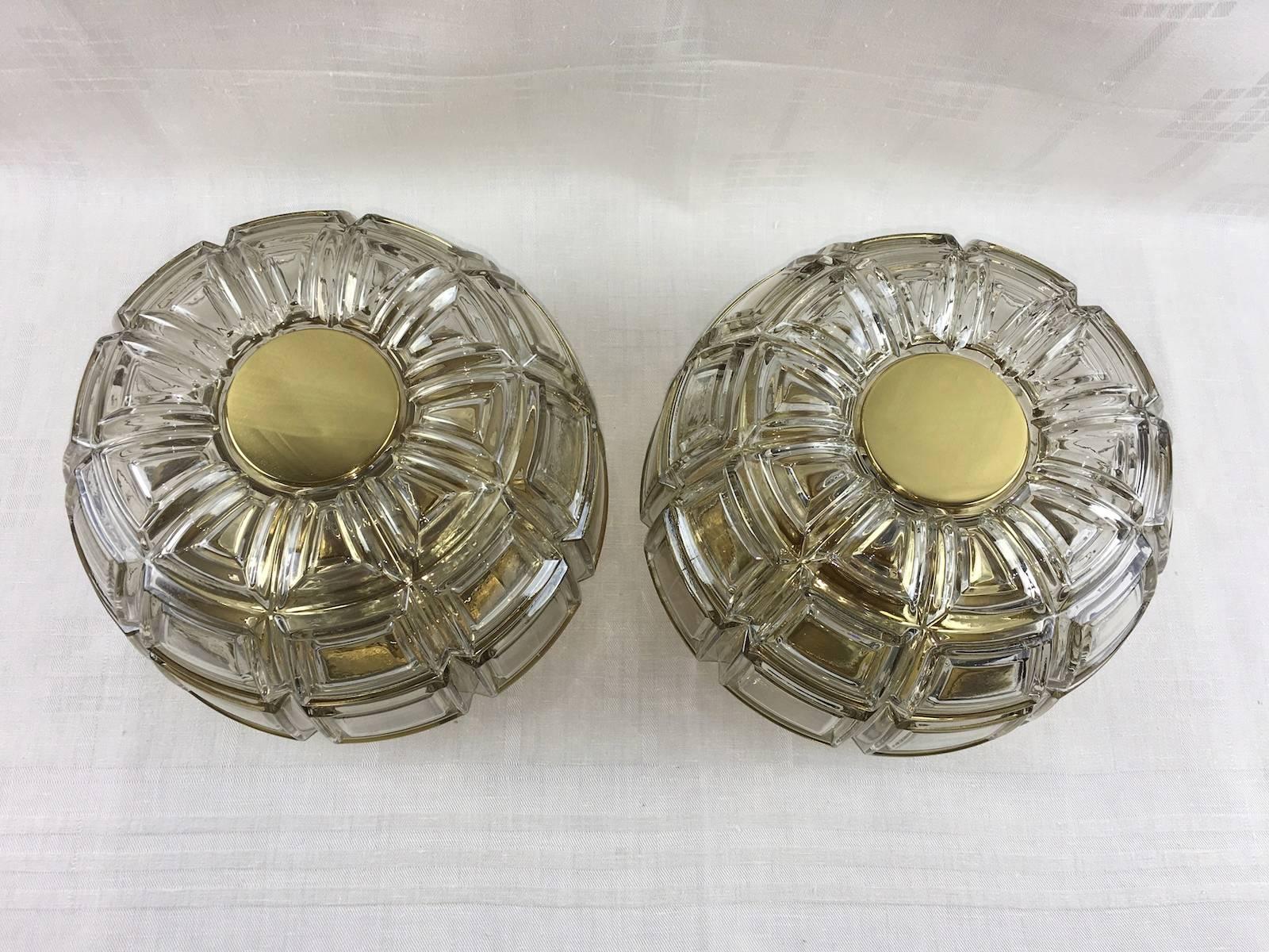 Pair of brass and amber glass sconces or flush mount manufactured by Limburg Glashütte, Germany, circa 1960-1969. 
Each fixture takes one E27 base Edison bulb up to 75 watts per bulb.