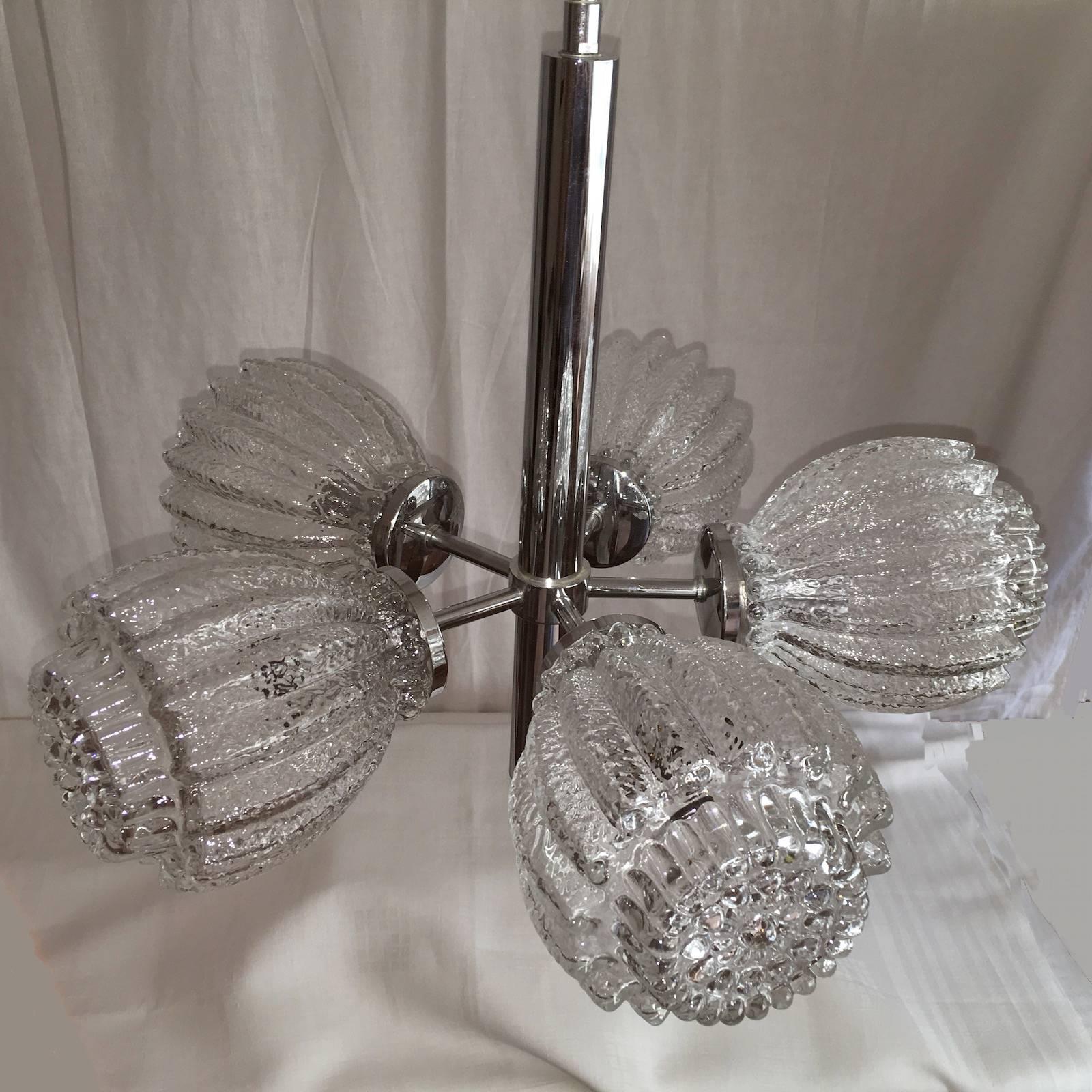 A beautiful calyx glass and chrome Mid-Century chandelier. A chrome fixture holds five thick calyx form glasses. Fixture requires five European E14 candelabra bulbs, each bulb up to 40 watts.
