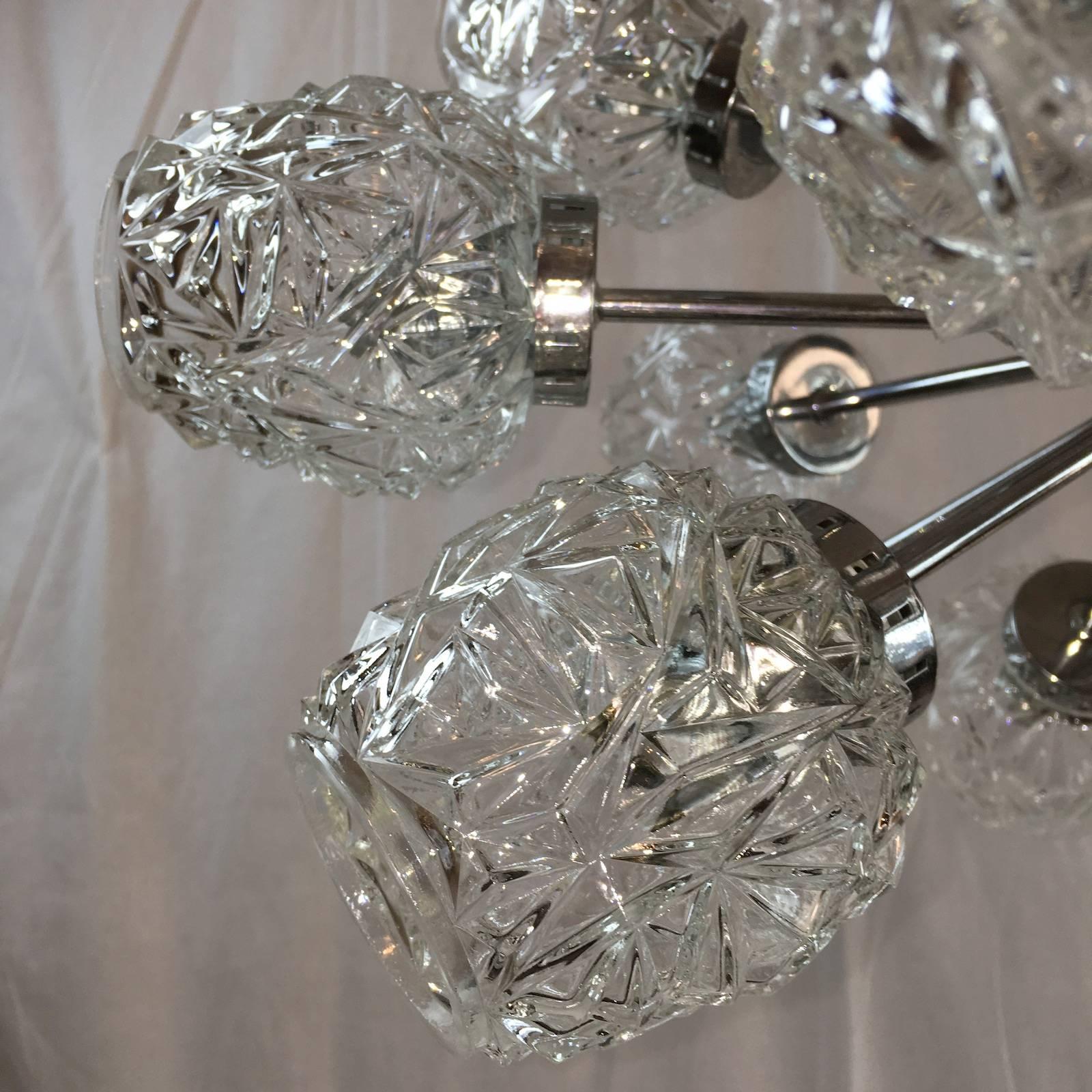 Fantastic sculptural sputnik chandelier by Richard Essig with eighteen cut crystalline pattern glasses. Fixture requires eighteen European E14 candelabra bulbs, each bulb up to 40 watts.