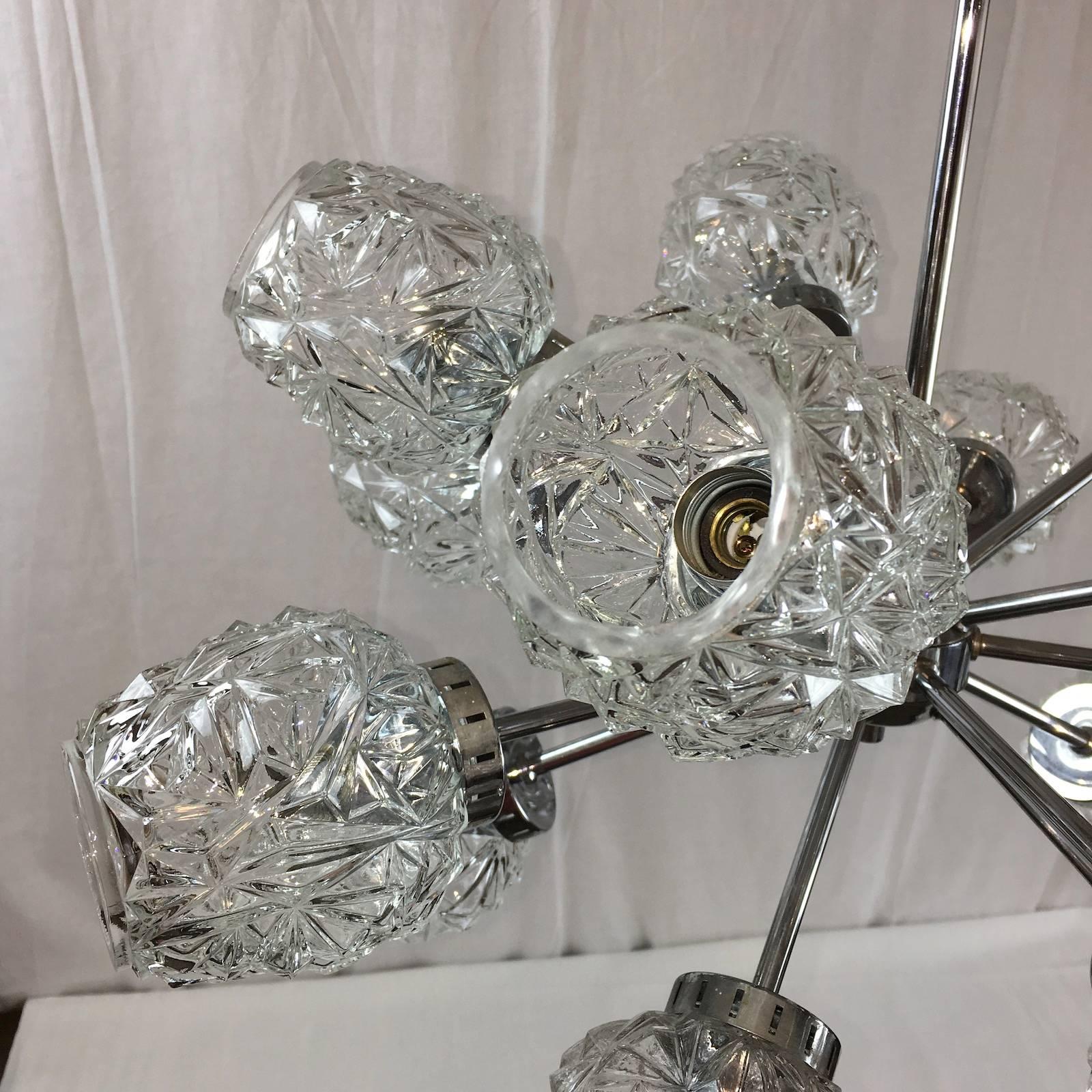 Fantastic sculptural sputnik chandelier by Richard Essig with fifteen cut crystalline pattern glasses. Fixture requires fifteen European E14 candelabra bulbs, each bulb up to 40 watts.