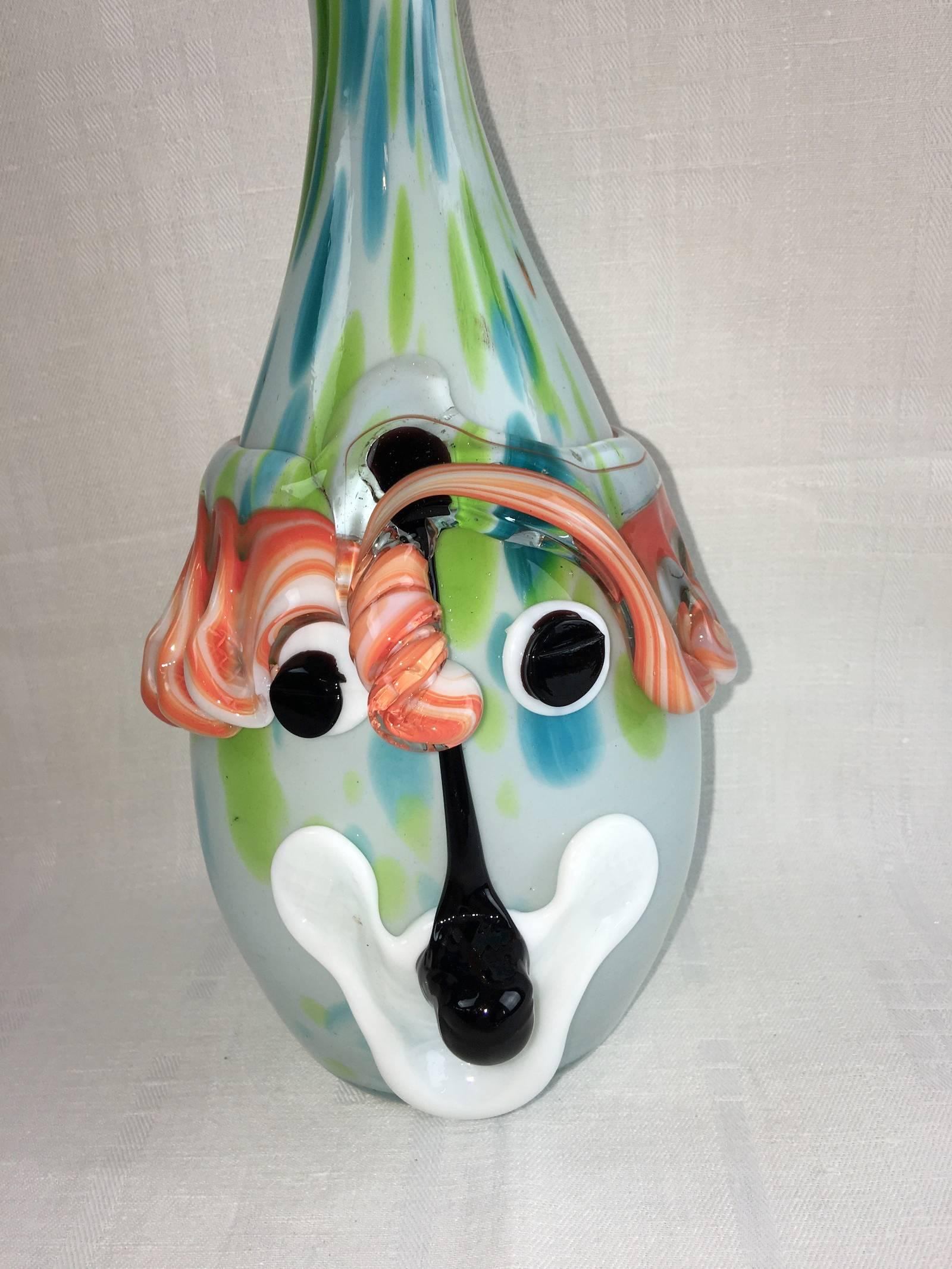 A rare piece of world class art glass Picasso abstract style with multi colors and outer facial features, distinctive face design with outer Murrine facial features and flamboyant design. The design is very much in the Mario Badioli & Oscar