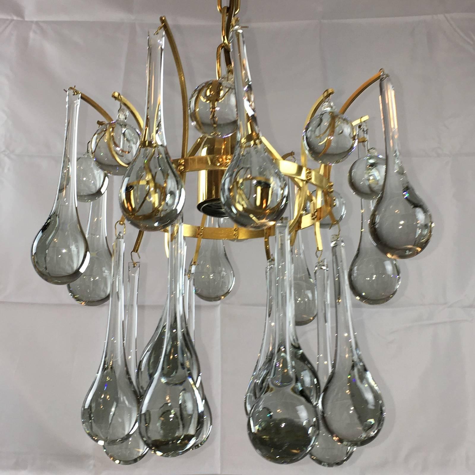 This petite Hollywood-Regency style chandelier was made in the 1970s by Ernst Palme, Germany. The fixture requires one European E27 Edison bulb, each bulb up to 60 watts.