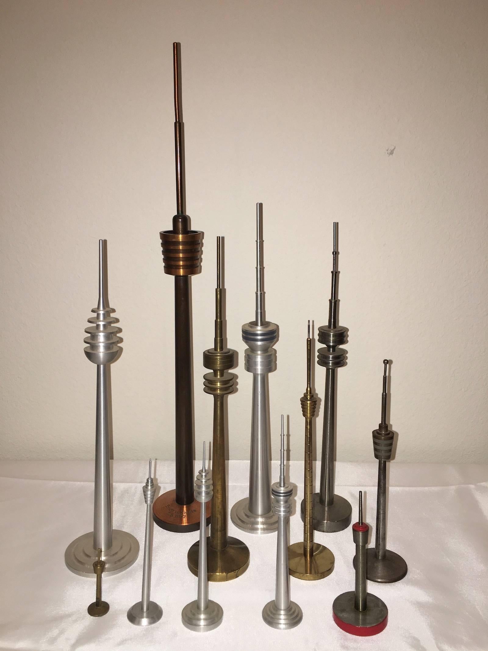 Scaled models of television tower models hand-spun in aluminum, brass, copper and other metals.
Tallest is approximate 18 1/2 inches high, smallest approximate 2 1/4 inches