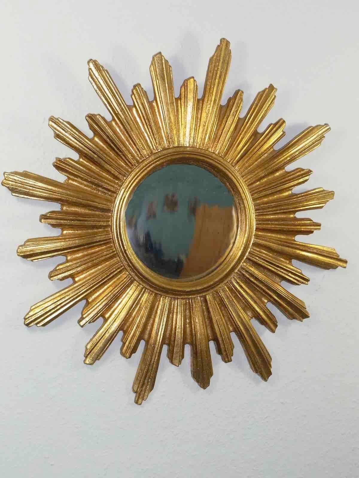 Gorgeous starburst mirror. 
Made of gilded Resin.
No chips, no cracks, no repairs.
Probably little dusty, but this is old-age.
It Measures approximate 21" in diameter,
Mirror only is approximate 6 1/4" in diameter.
It stands