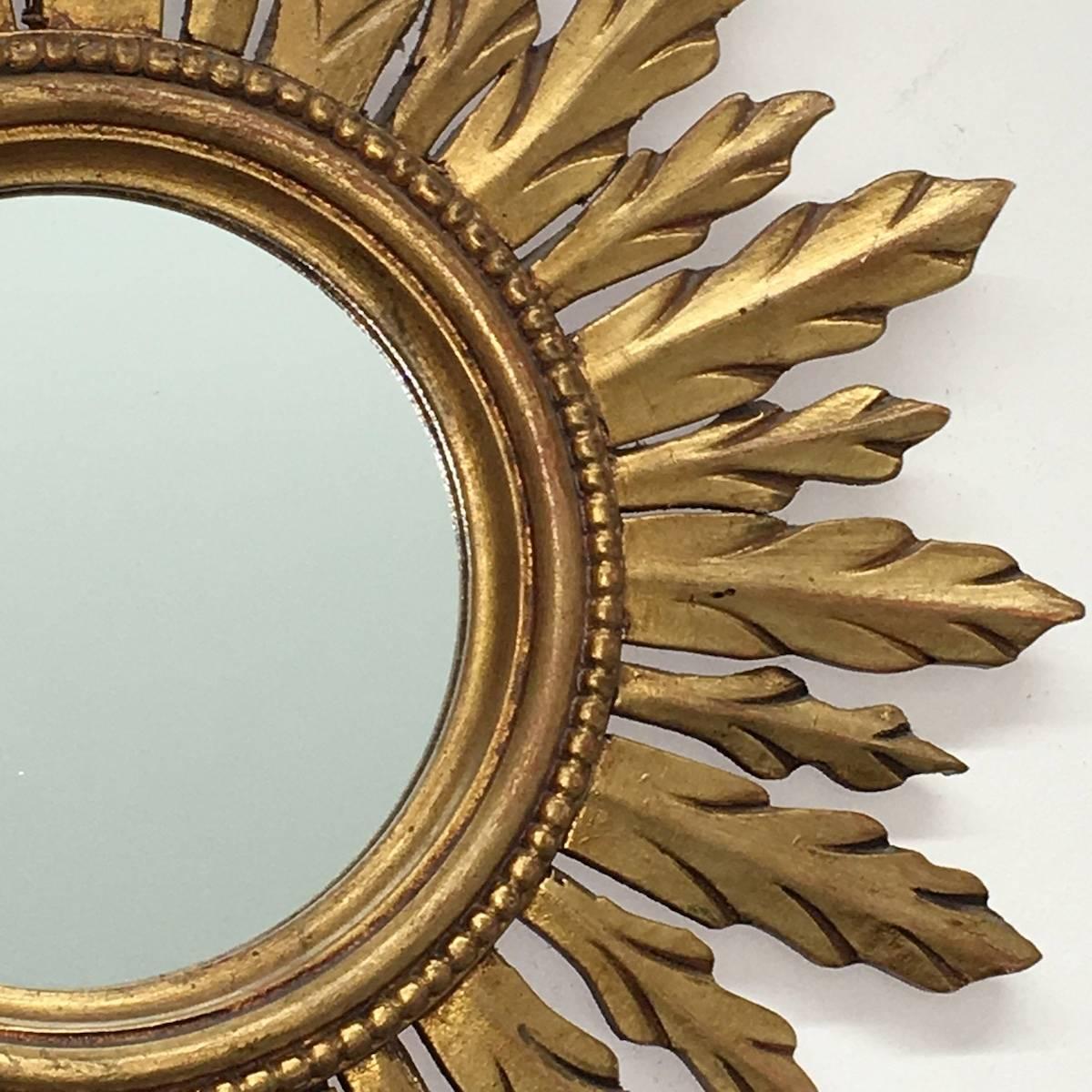 Gorgeous starburst mirror. 
Made of gilded wood.
No chips, no cracks, no repairs.
It measures approx. 19 1/4