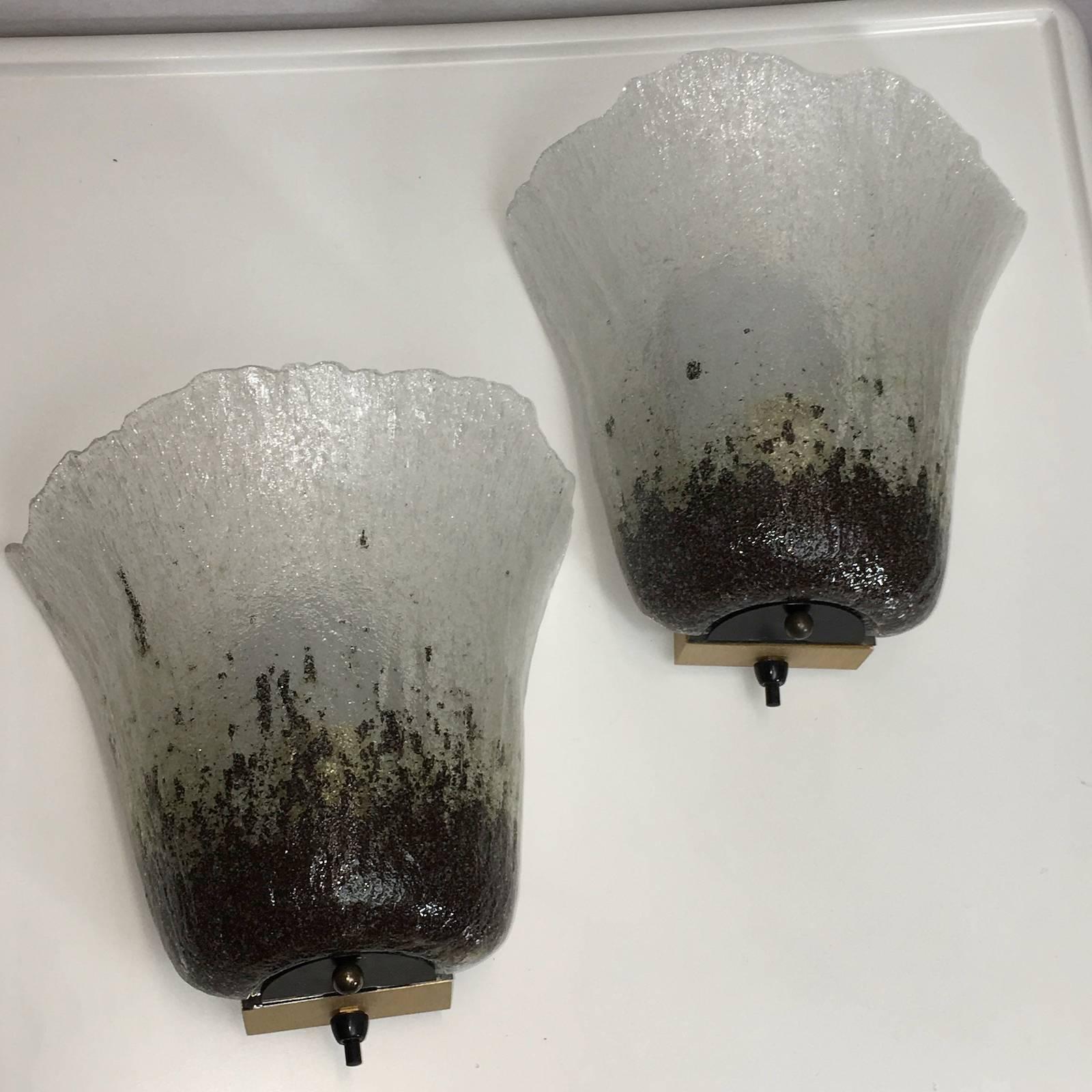 Pair of beautiful sconces made by Peill and Putzler, in the Koch and Lowy style of the  1970s. Each light has a metal frame with thick Murano style glasses.
Each sconce takes one European E27 Edison Bulb with max. 75 Watt per bulb.