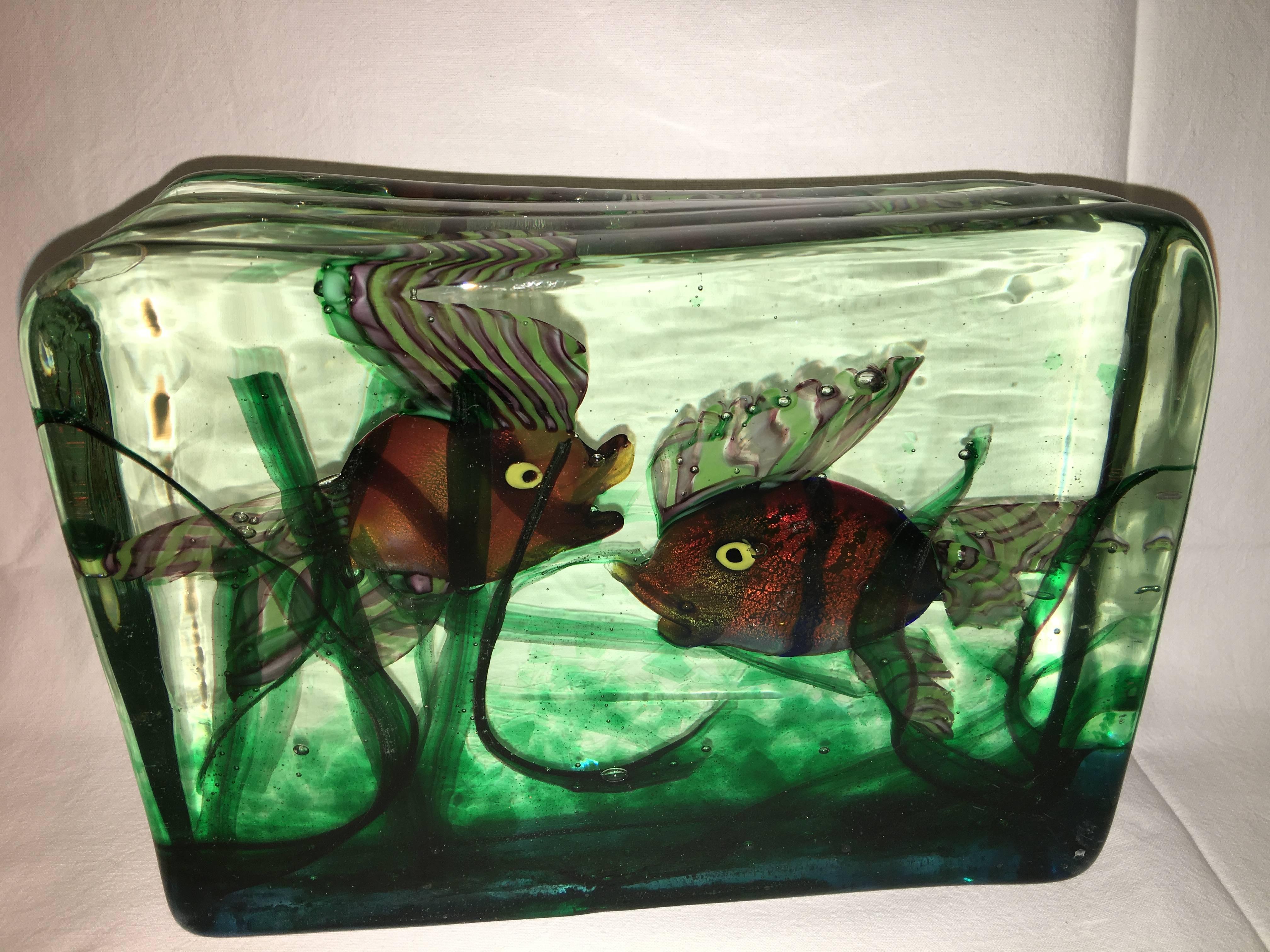 A large Murano glass aquarium by Gino Cenedese.
Design attributed to Riccardo Licata.
Three dimensional water scene created from three colorless glass panels with poly chrome fish and grasses, it looks alive !
Italy, circa 1950.