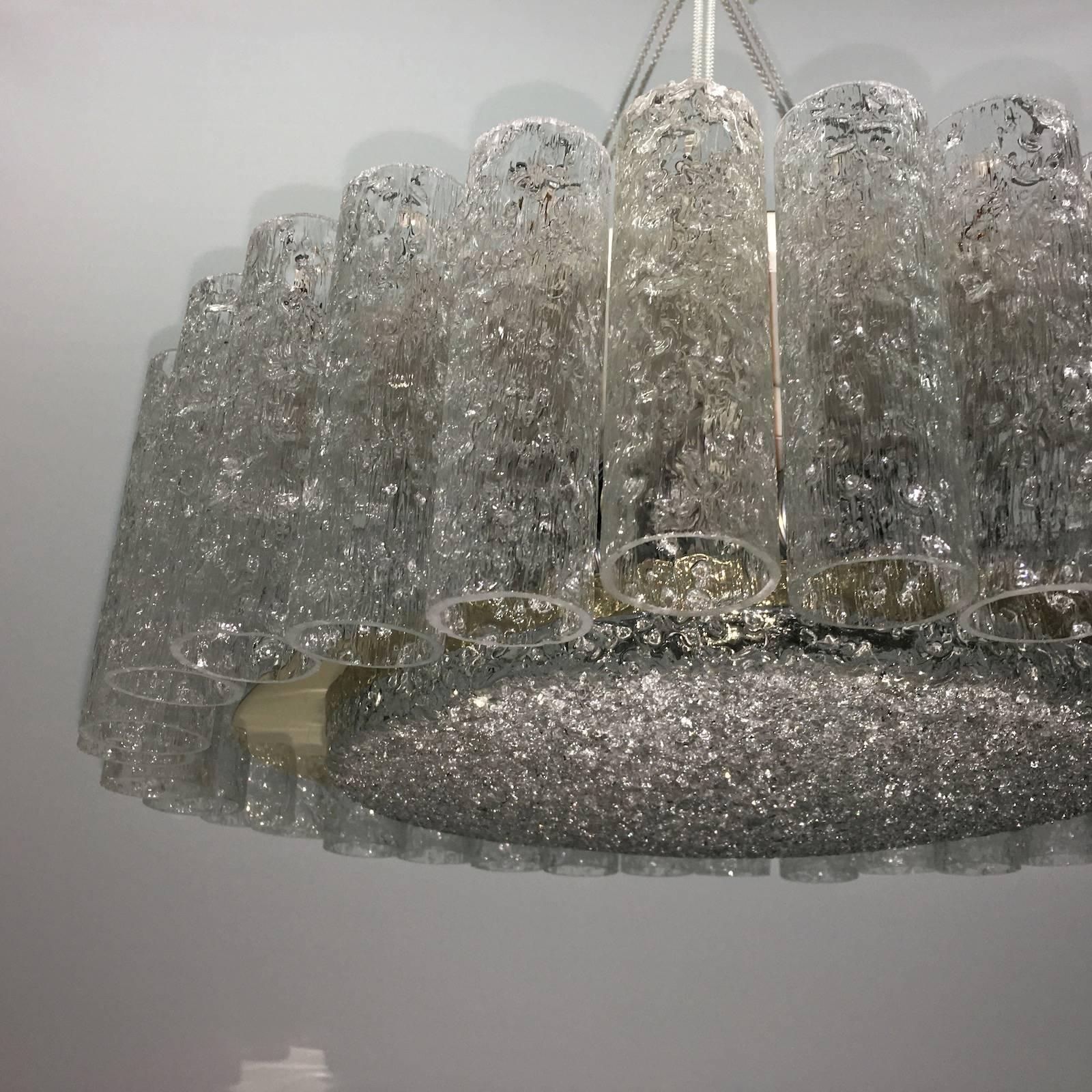 Mid-Century Doria chandelier, structured glass surrounding a brass ring and granulated glass disc. The Fixture requires 6 European E27 Edison bulbs, each bulb up to 60 watts.