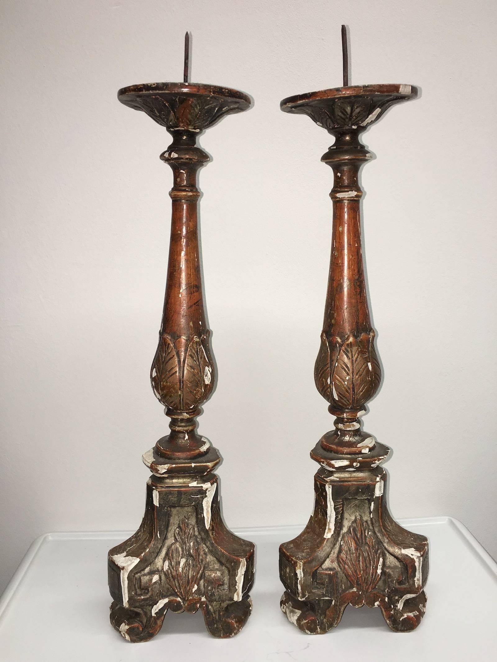 Antique Italian gilt wood church altar candlesticks, mid-1700s. Beautiful original condition, losses to surface and paint (please see all photos), old woodworm holes which are typical for antique wood items. A great conversation set and illuminate