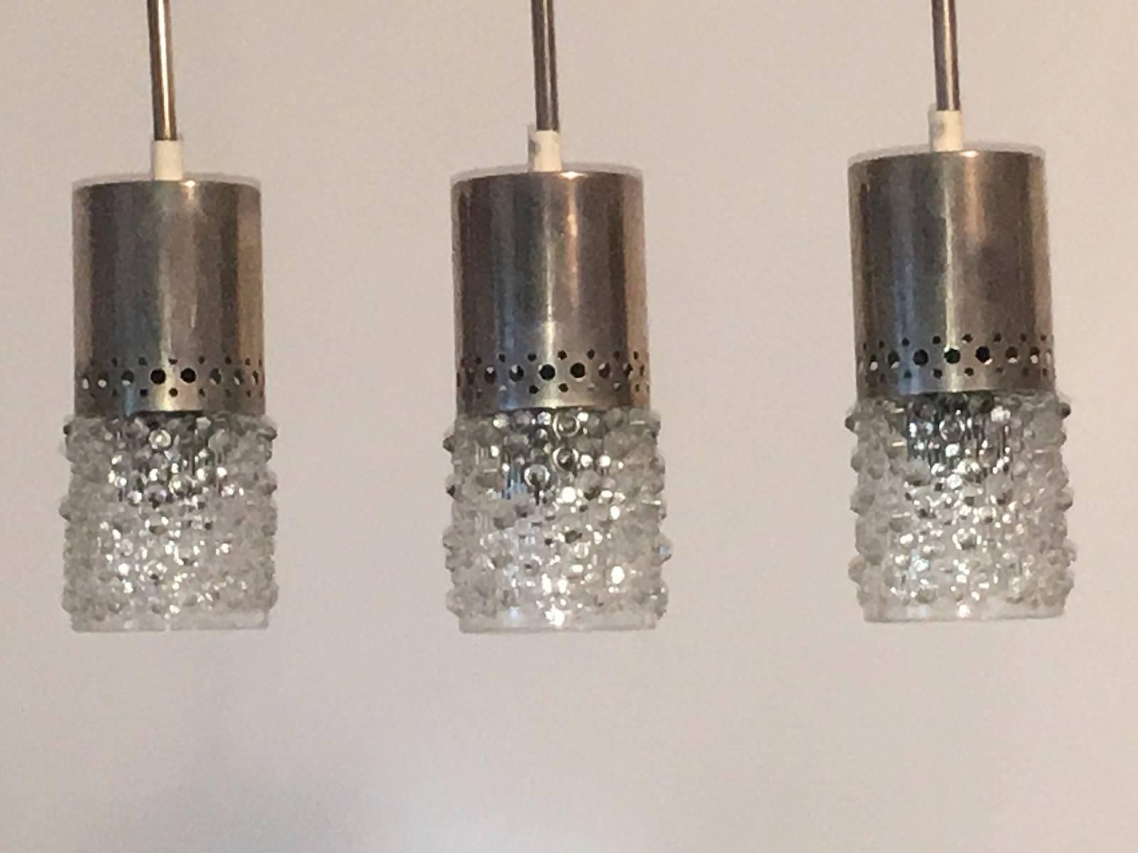 A set of three bubble glass chrome pendant each fixture requires one European E14 candelabra bulb, each bulb up to 40 watts.