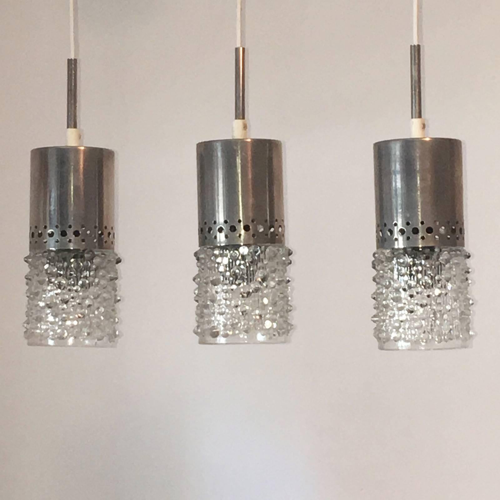 A set of three bubble glass chrome pendant each fixture requires one European E14 candelabra bulb, each bulb up to 40 watts.