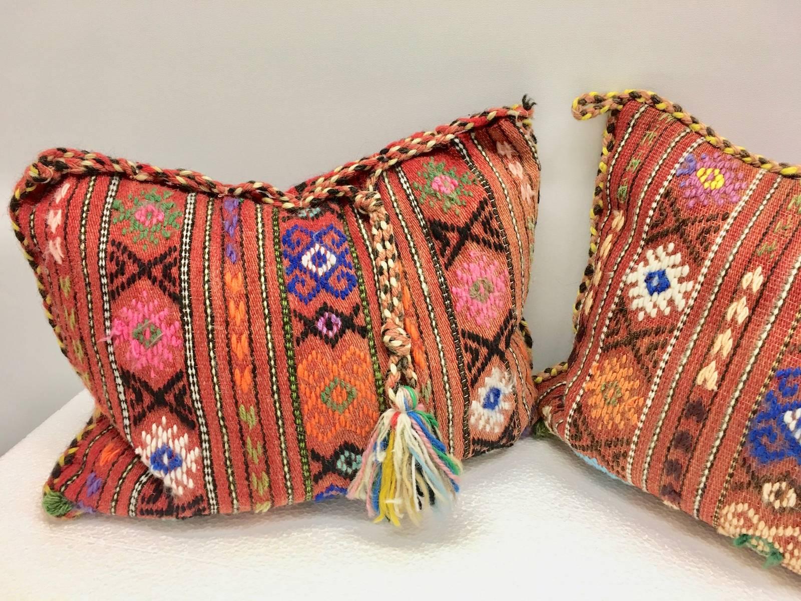 Gorgeous pair of oriental pillows. Handmade of woolen salt bags and oriental rug. Each measures approximate 13.25 inch high, is approximate 18.75 at the widest point and about 5 inch deep.