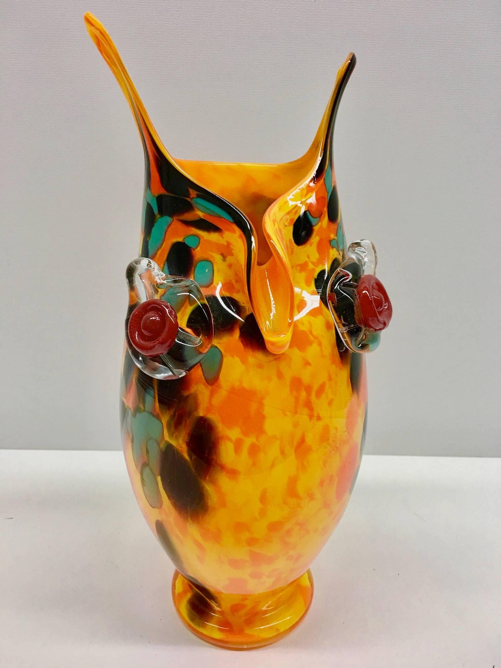 Beautiful Italian vase dating, circa 1970s. Orange, yellow, black and green glass swirls down to the ground. Made in Murano, Italy.
A great piece for any room or gift for any occasion. Brightens up any room.
     