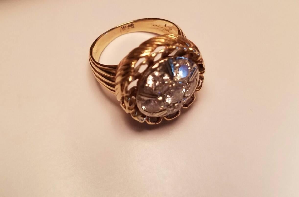 Sized 5 ½ ladies 14-karat yellow gold diamond dinner ring. Ring has a round cluster top in 14-karat white gold. It has a six diamond cluster. There are 5.15 pts round diamonds and 1.25 pts round diamond. Total weight of diamonds is 1.15 pts.