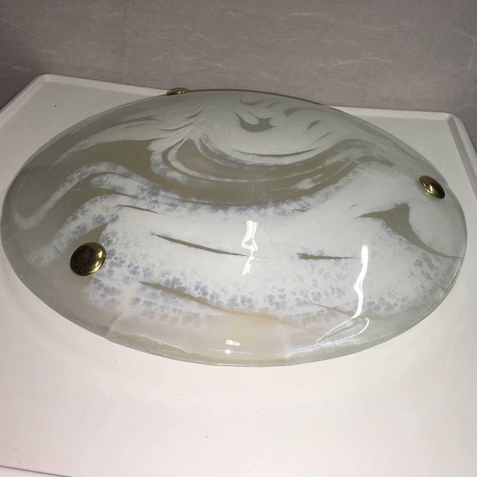 Beautiful white and clear swirl glass flush mount by Hillebrand of Germany. Made of heavy and very thick glass, with brass back plate.

Takes three E 14 base bulbs up to 40 watts per bulb.