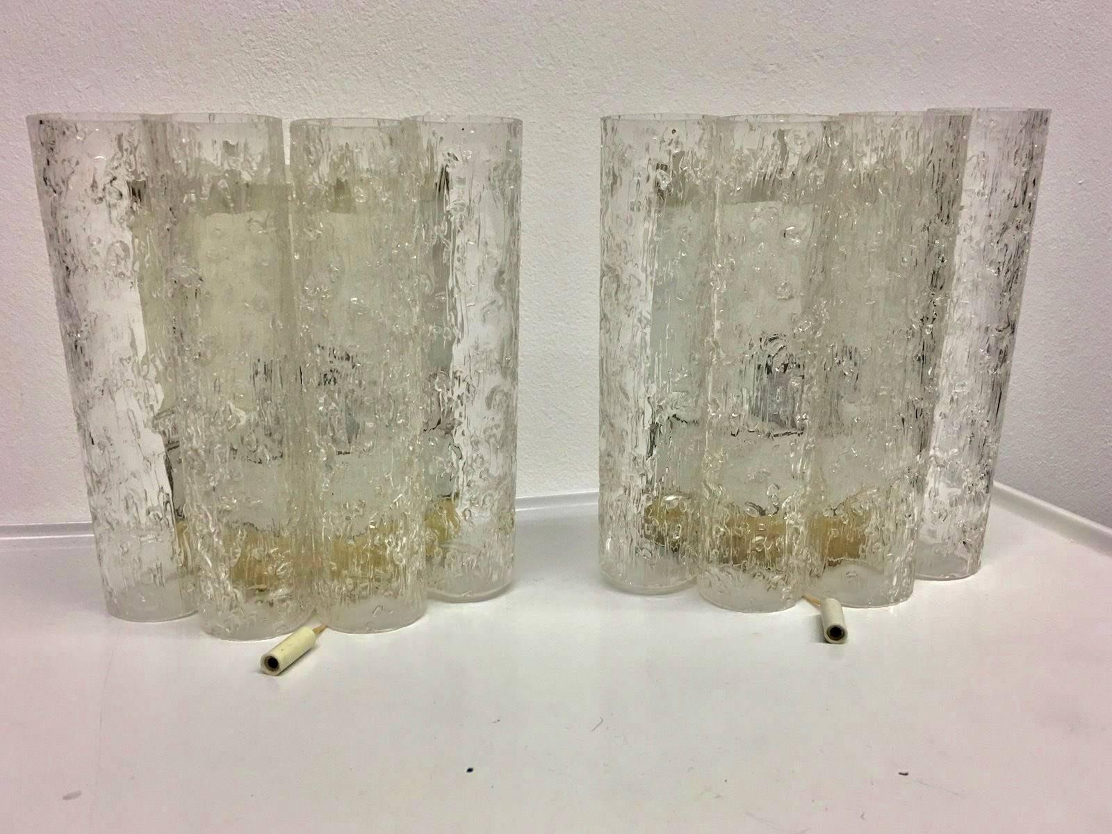 Pair of sconces mid century by Doria Leuchten of  Germany. Each fixture requires one European E14 candelabra bulb, each bulb up to 40 watts.
Lovely lighting effect.