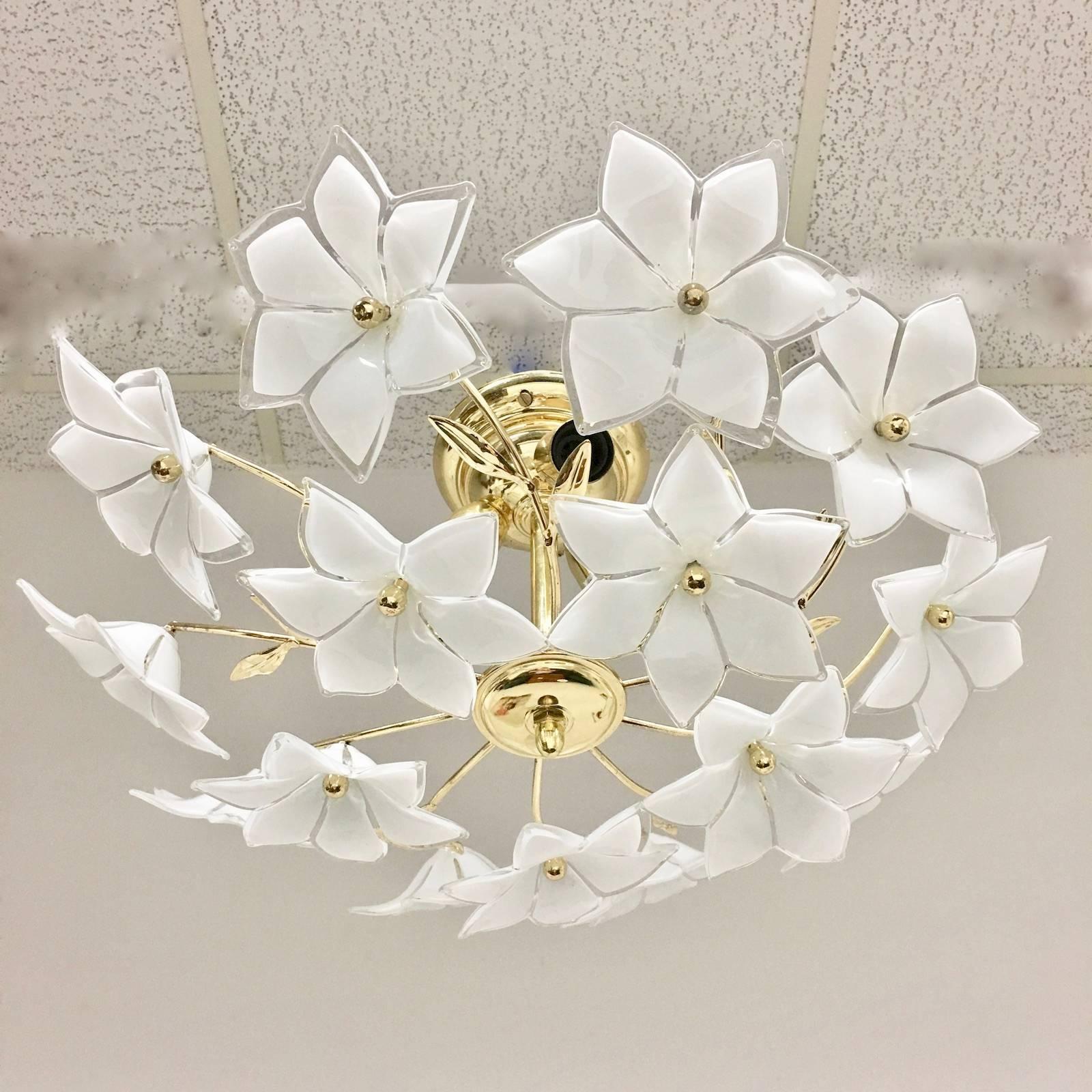 Beautiful Elegant and petite Italian wall light or flush mount with Murano glass flowers. The fixture requires three E 14 bulbs up to 40 watts each. A lovely Wall or Flush Mount. 