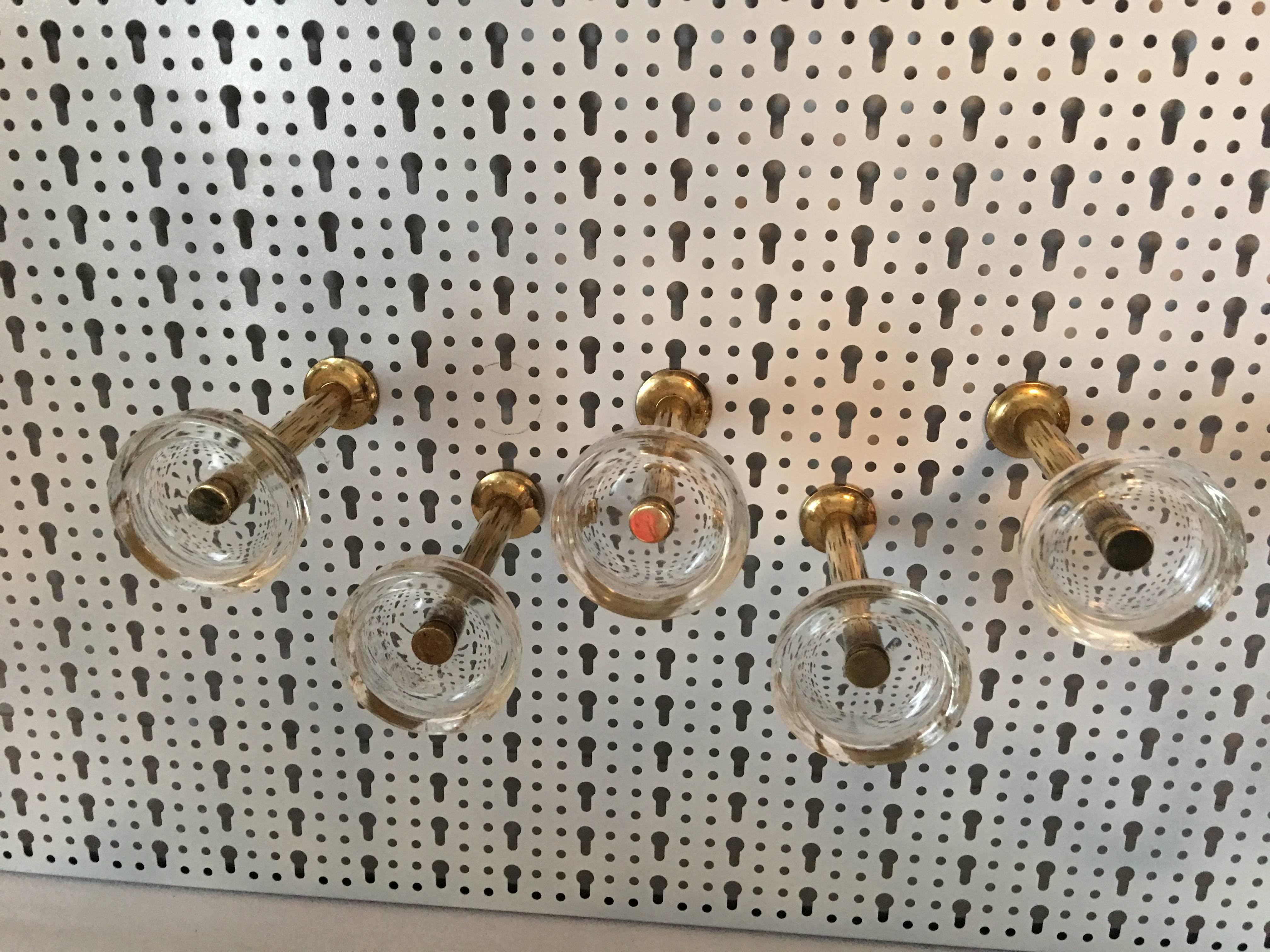 Five brass and glass wall hooks. 1970s, Italy. A very unique set of decorative hooks. A real eyecatcher.