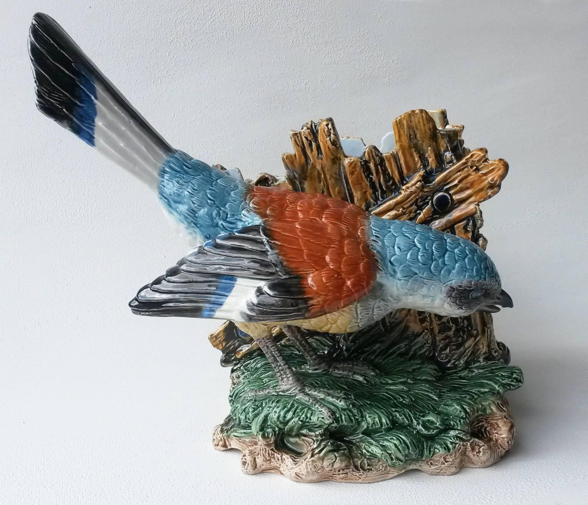 Very rare German Majolica fine bird jardiniere possibly a jay signed Hugo Lonitz.
The jardiniere on the back of the bird is a wood fence with insects.
Excellent quality of details.
Hugo Lonitz is known for his remarkable skill to reproduce the