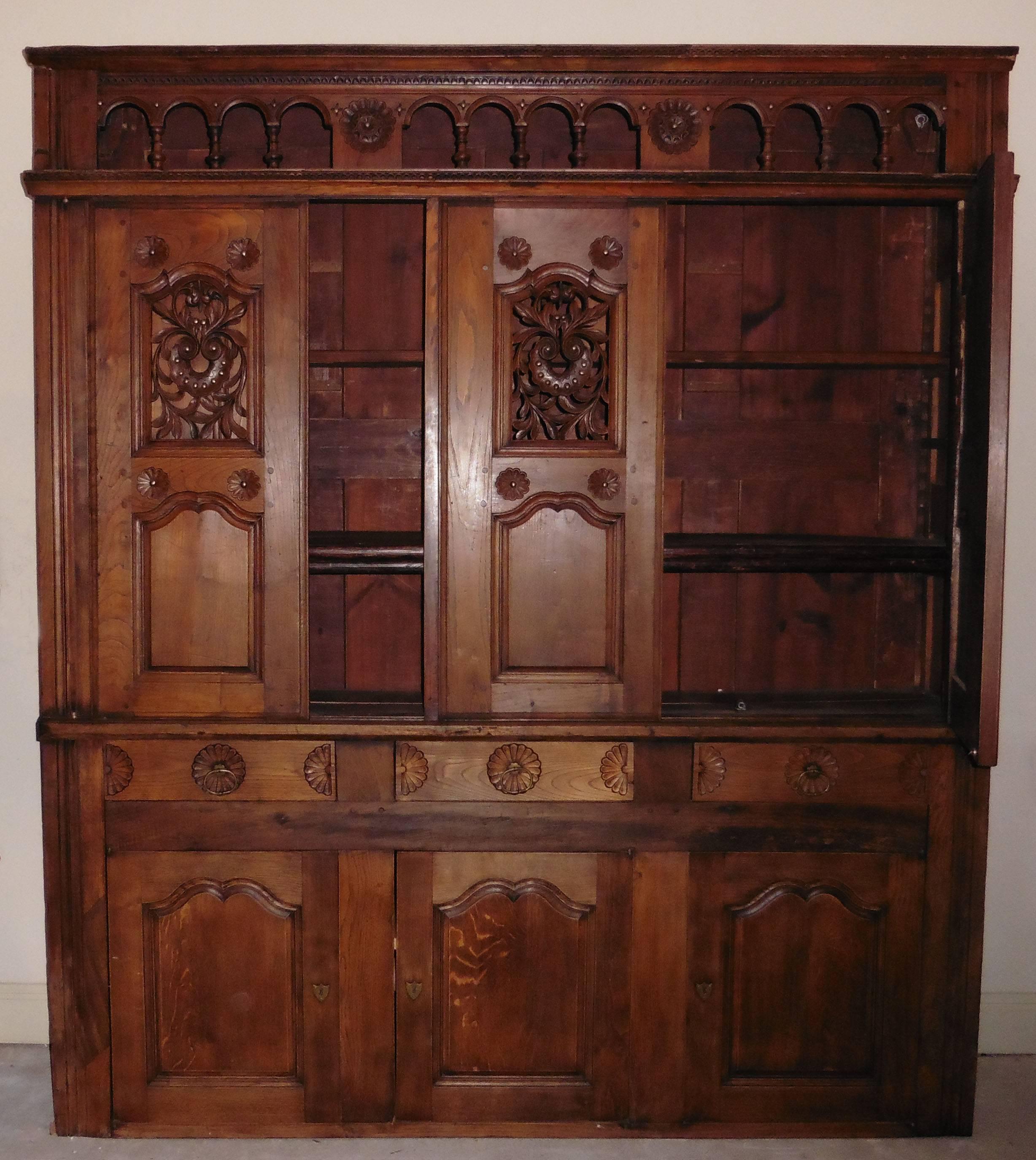 Spectacular 19th century, French carved buffet cabinet from Brittany. The buffet is entirely carved from chestnut tree.
Sliding doors, three drawers and three doors.