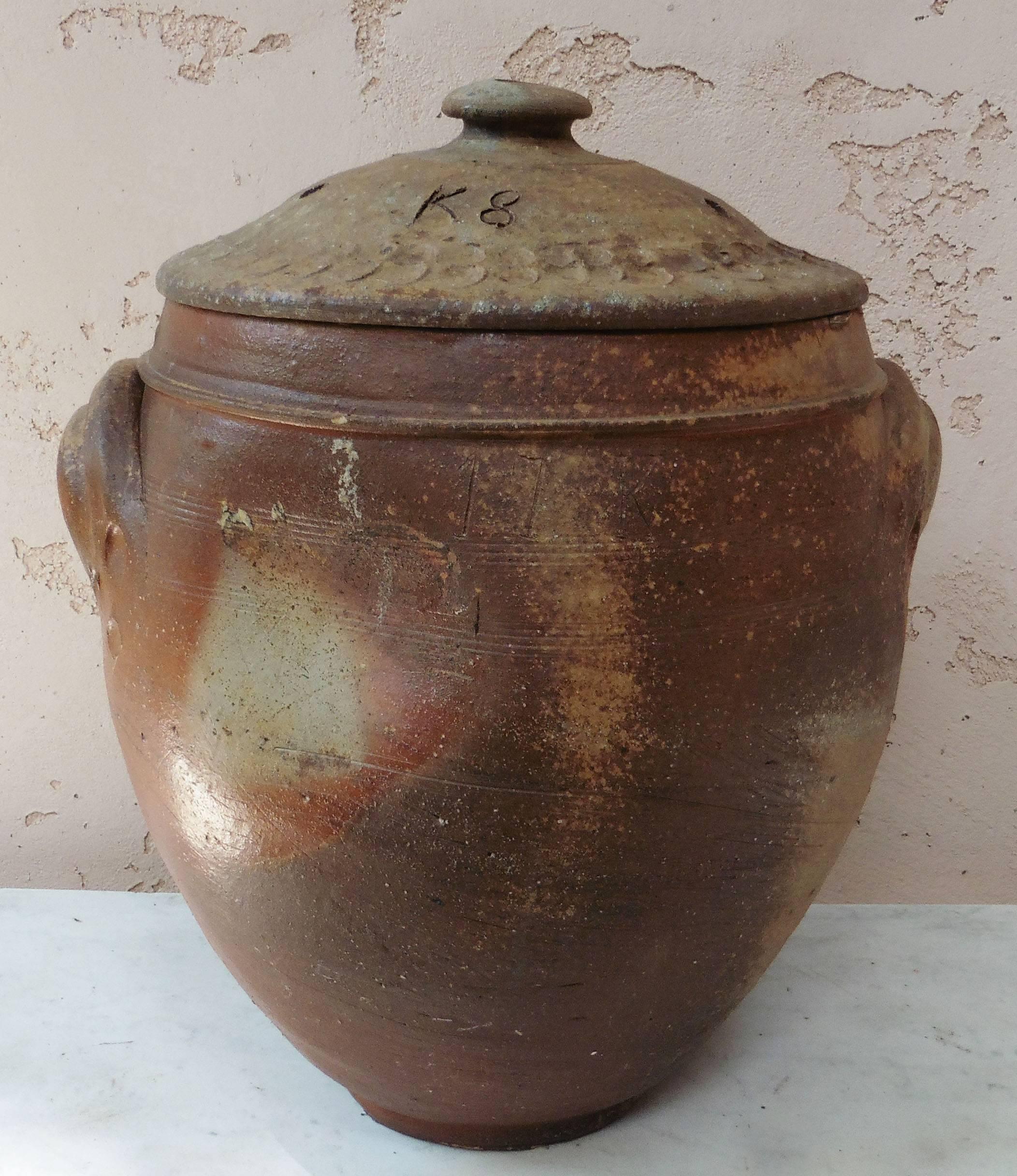 Large French pottery salting jar with lid from Normandy, circa 1890.
Earthenware salt glazed.