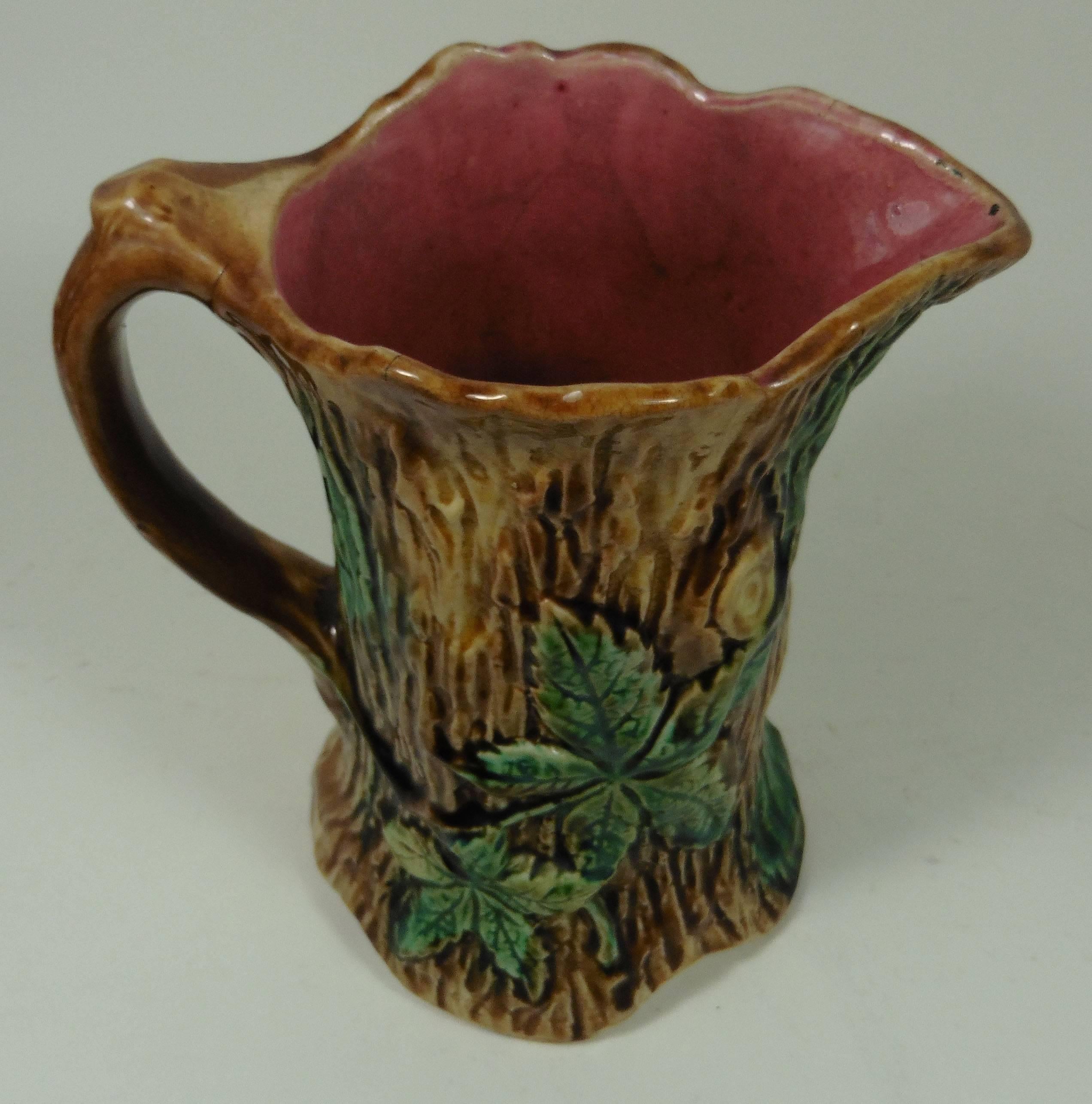 French Majolica trunk pitcher with leaves signed Onnaing, circa 1900.