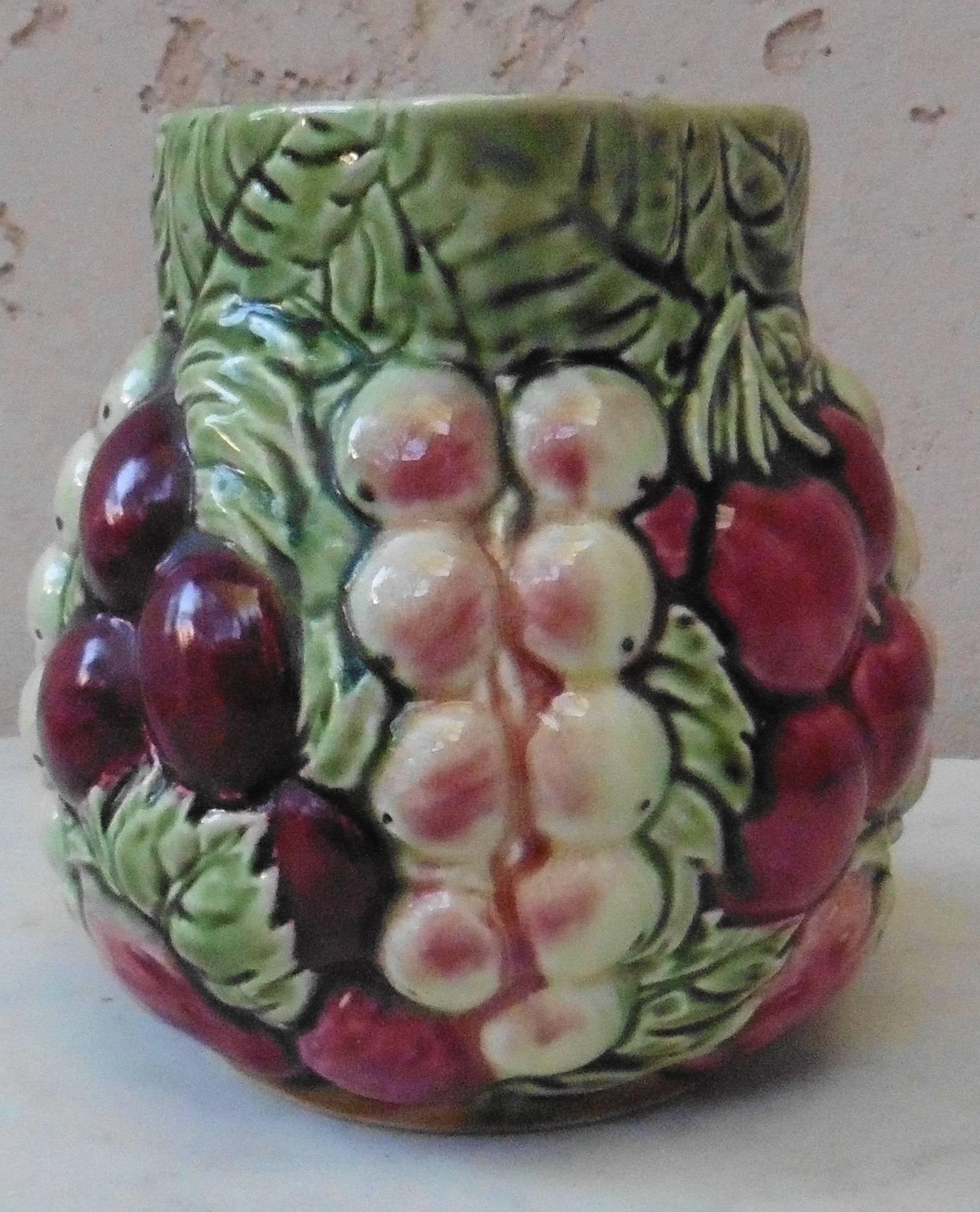 Rare Majolica fruit pitcher (cherries, strawberries, white currants, plums) signed Sarreguemines, circa 1930.