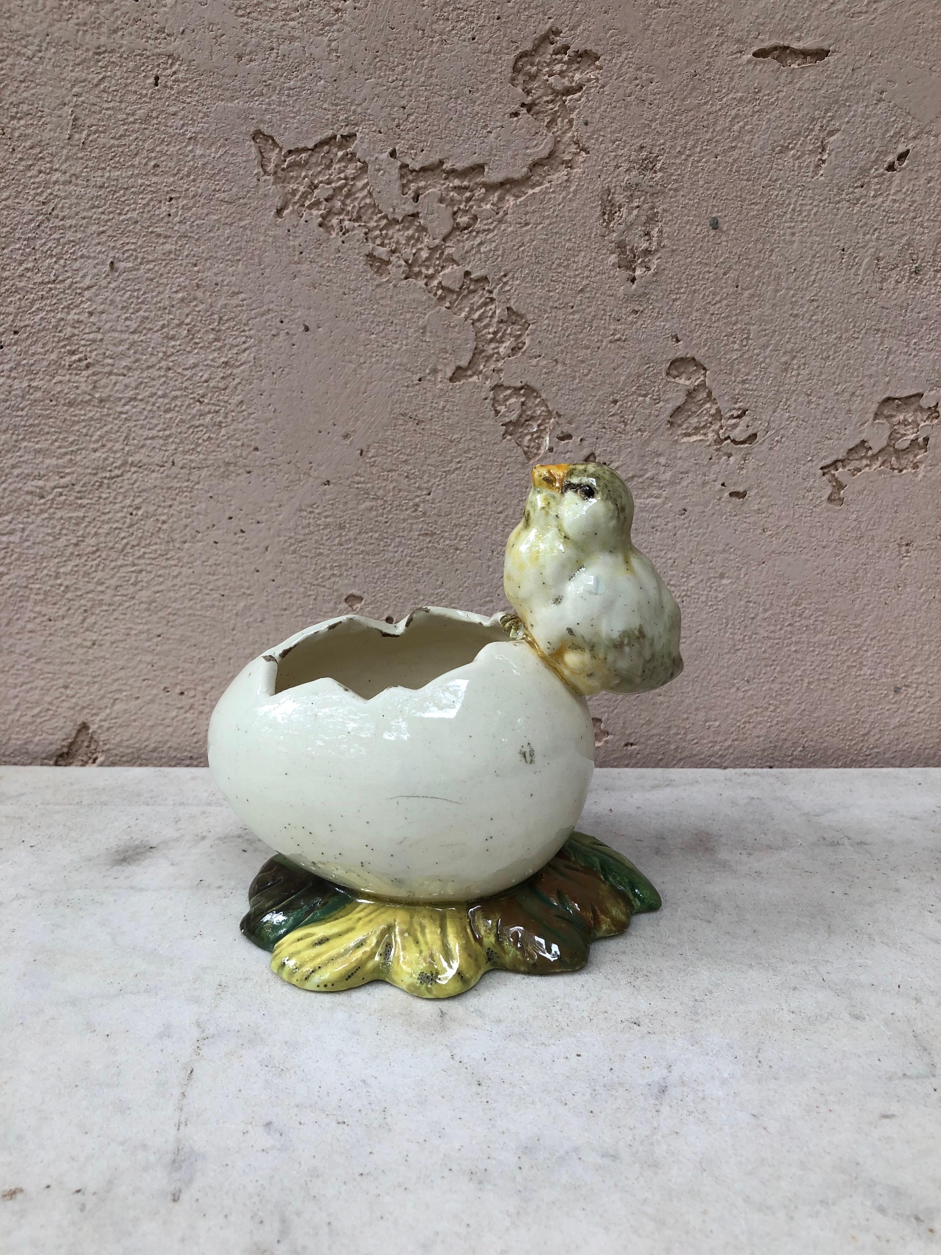 Rare Majolica chick with egg vase signed Delphin Massier with hand painted violets, circa 1900.
Measures: Length / 5.5 on 3.8 inches, height / 5 inches.