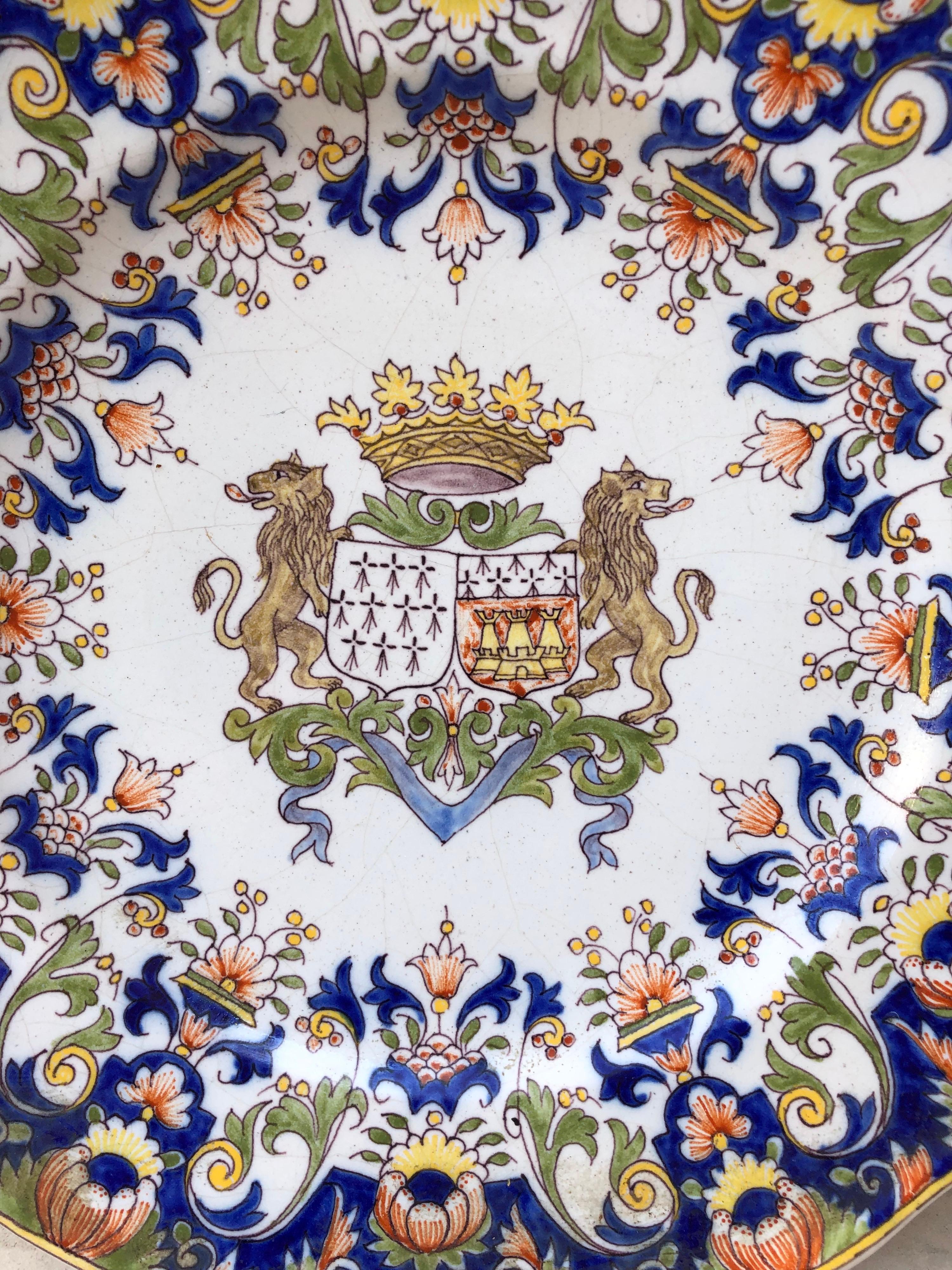 A French faience platter with a coat of arms and rich floral border attributed to Fourmaintraux Desvres, circa 1890.
Souvenir de Bretagne.
Size: 10.5