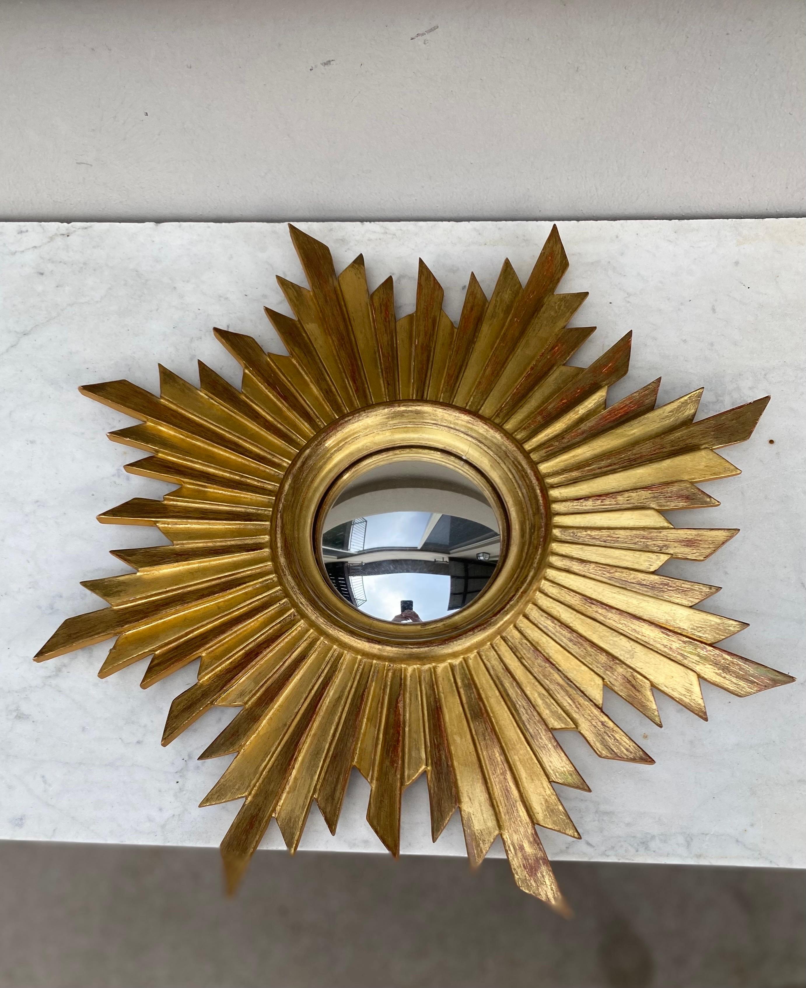 French midcentury gilded wood sunburst convex mirror, circa 1950.