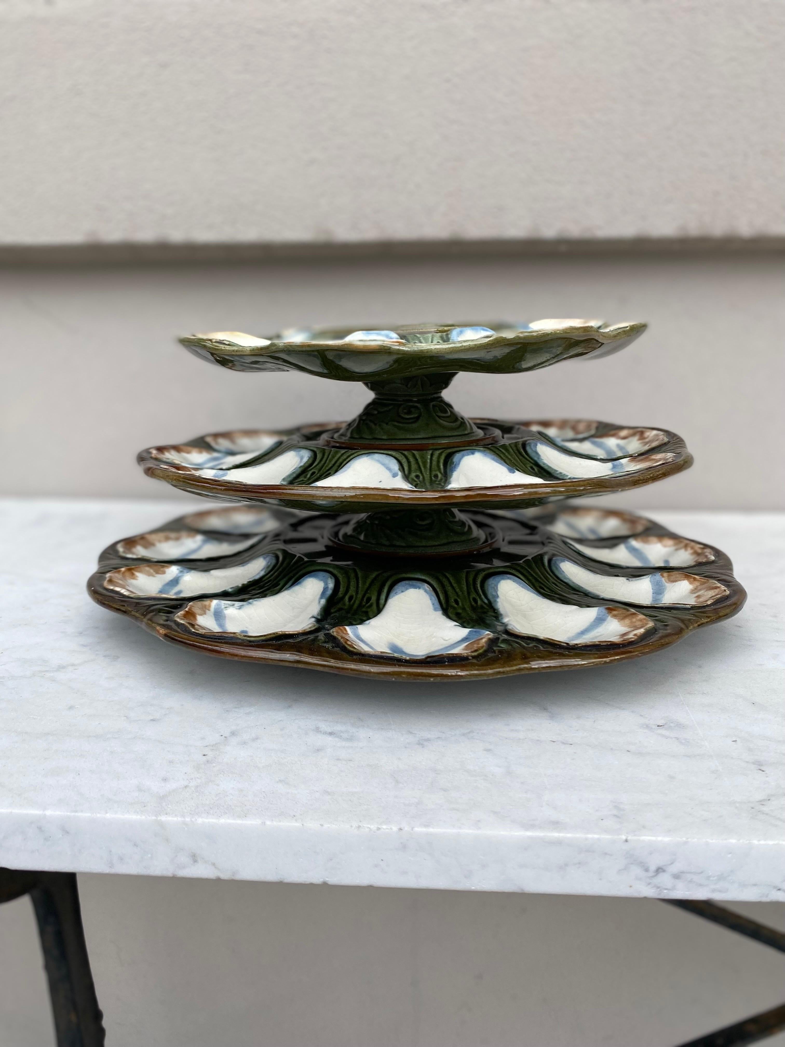 19th century rare French Majolica Oyster Server signed Longchamp.
Measures: 3 platters / 14 inches diameter, 1.3 inches height.
11.5 inches diameter 2.5 inches height.
9.5 inches diameter, 2.5 inches height.