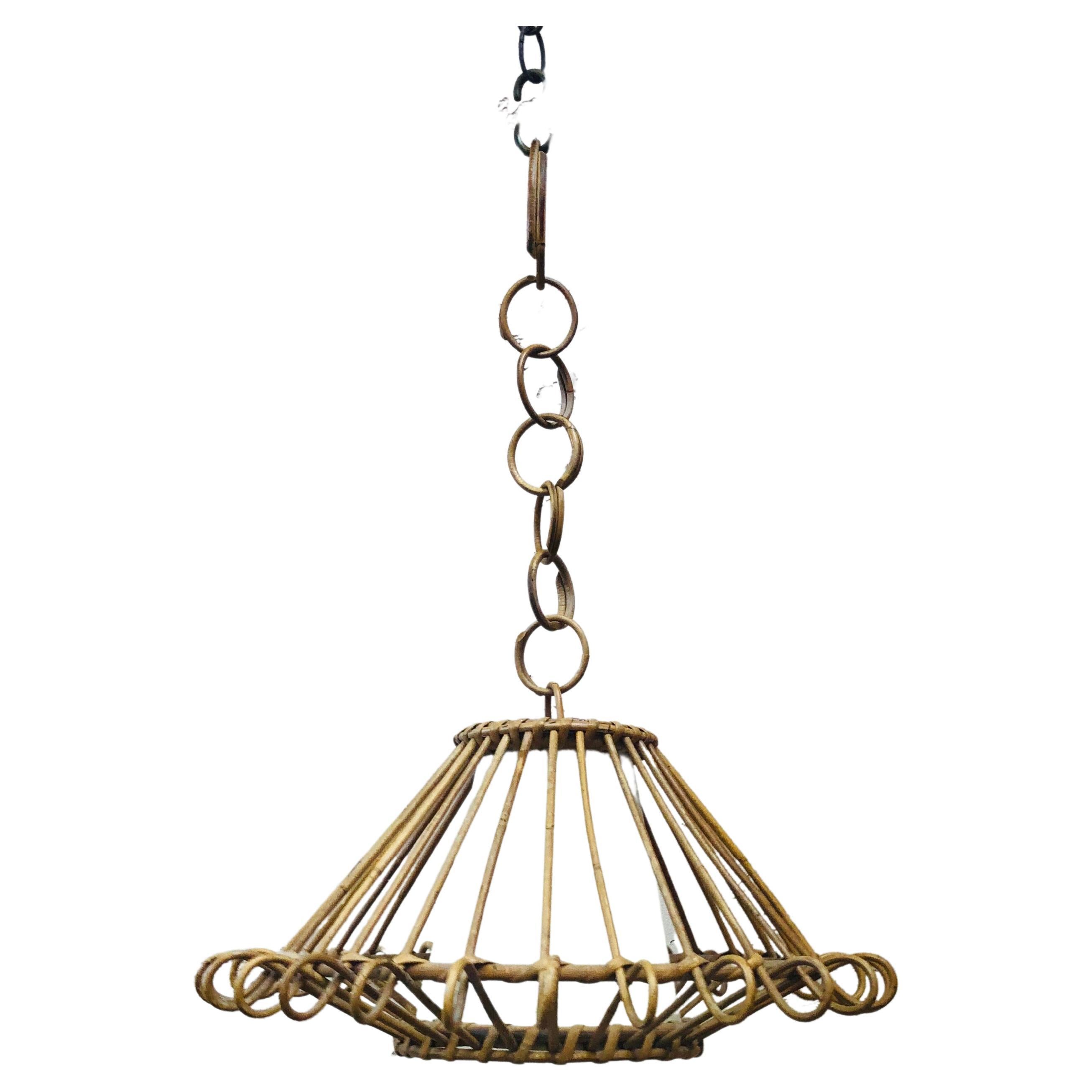 Large French Mid-century rattan chandelier Louis Sognot, circa 1950.
26 inches diameter.