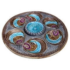 Assiette à huîtres en majolique du 19ème siècle avec têtes de poissons Onnaing