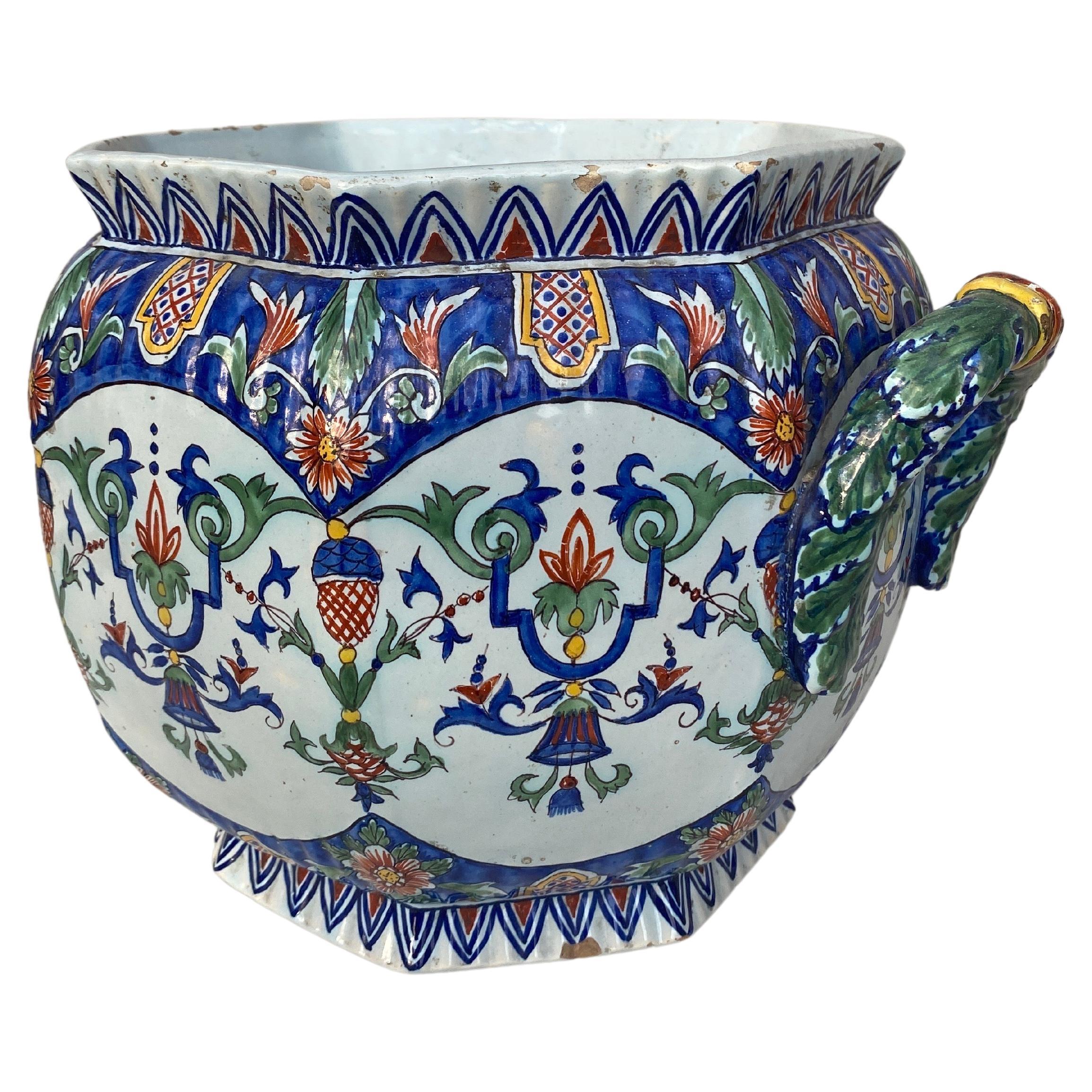 19th century large French Faience Cachepot Fourmaintraux Desvres 
Fourmaintraux in Desvres ( North of France )
Decor inspired by Rouen manufacture.
Very colorful and heavy jardiniere.
Few chips and hairline on the bottom doesn't alter the
