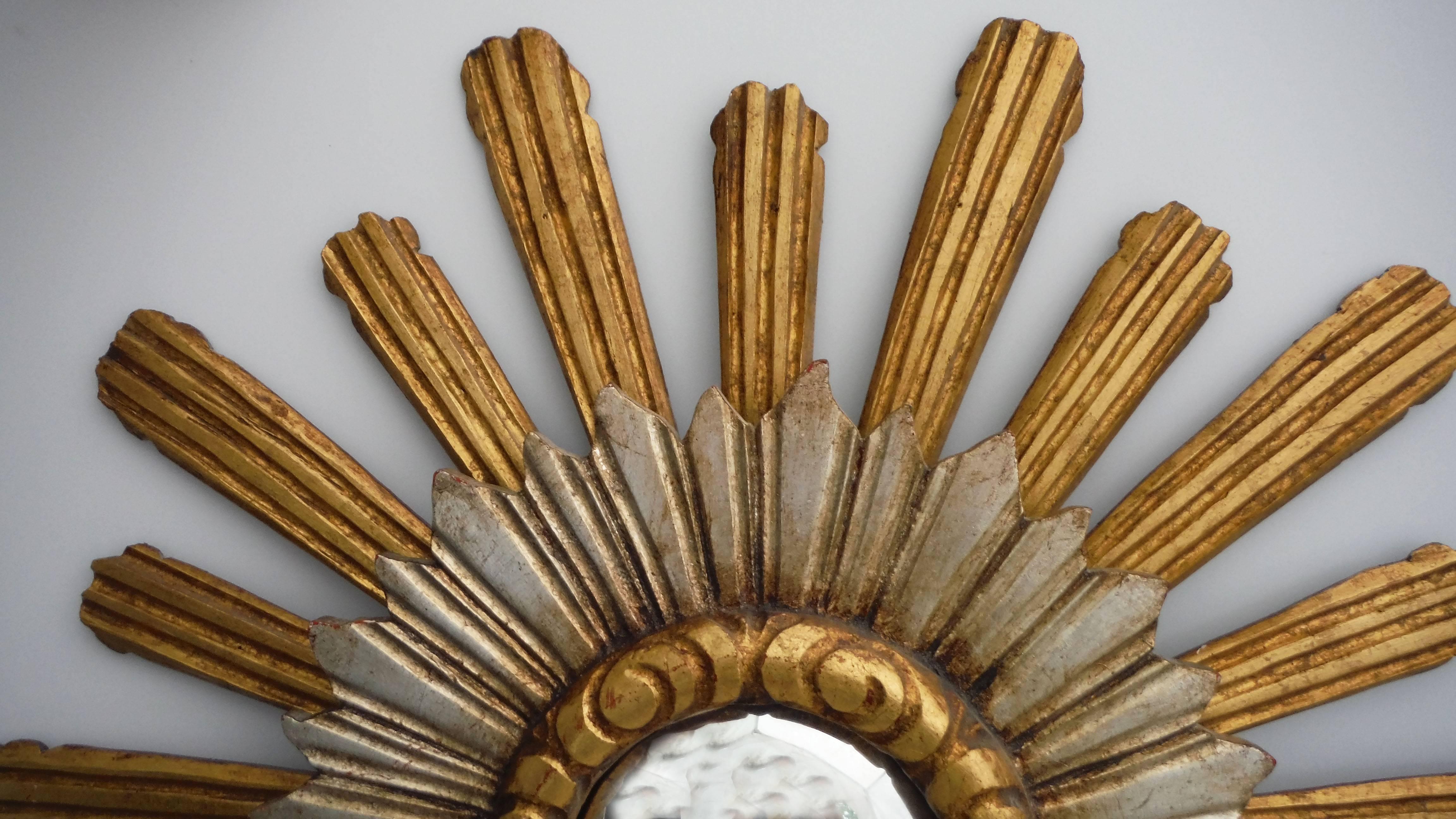 French sunburst convex double layered gilt and silver mirror.