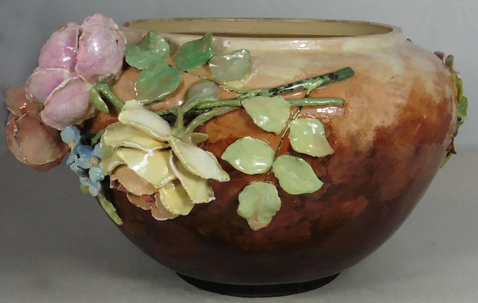 Large French impressionist majolica barbotine pastel roses jardiniere in a rare ochre peach background, circa 1880.
This jardiniere of the impressionist period was made by the school of Auteuil
(Near Paris) this pieces are frequently