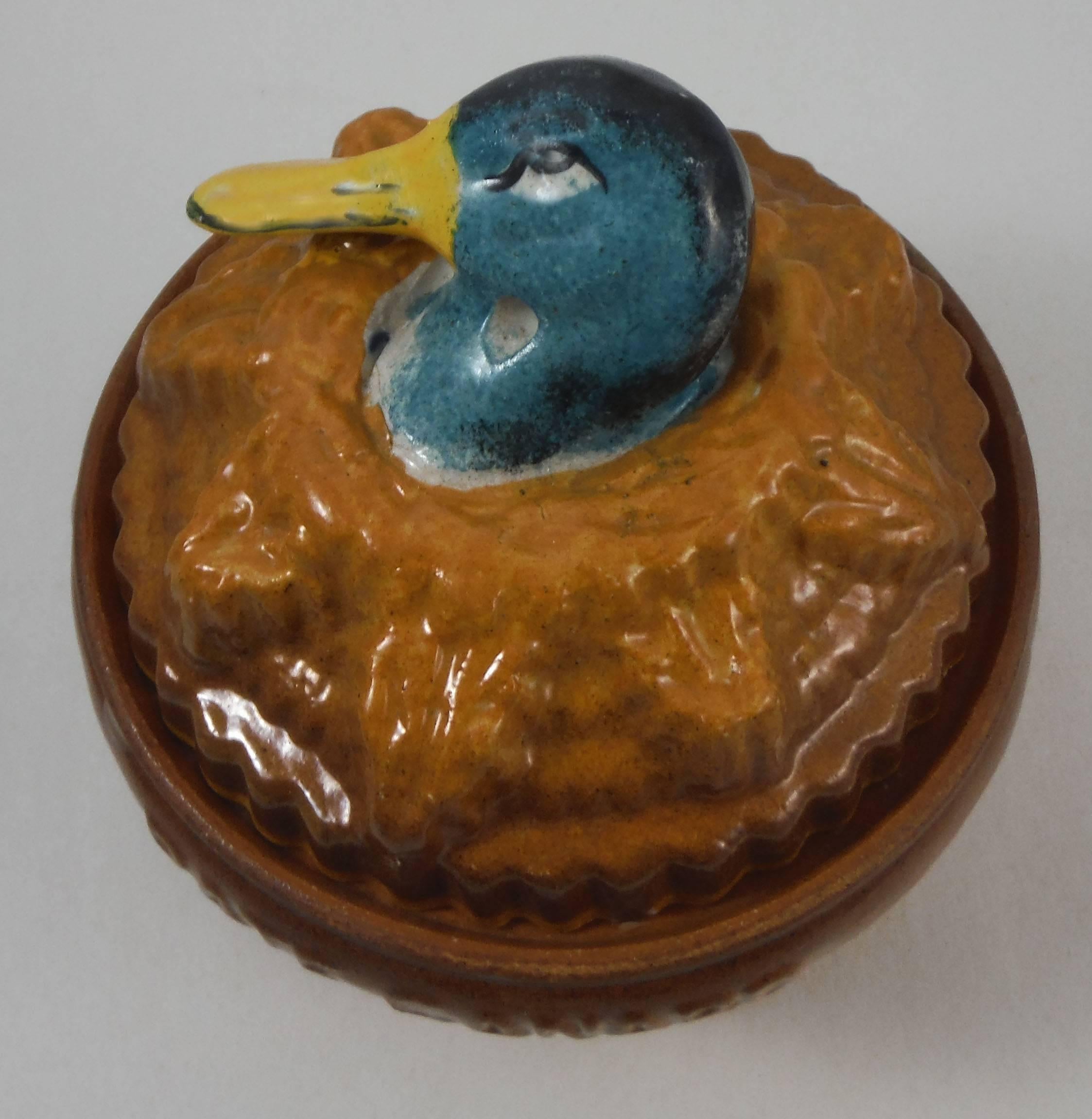 Pate duck tureen signed Georges Dreyfus for Faucon-Rouen circa 1900 in a trompe l'oeil form of pork pie with duck head handle. Minors wears.
