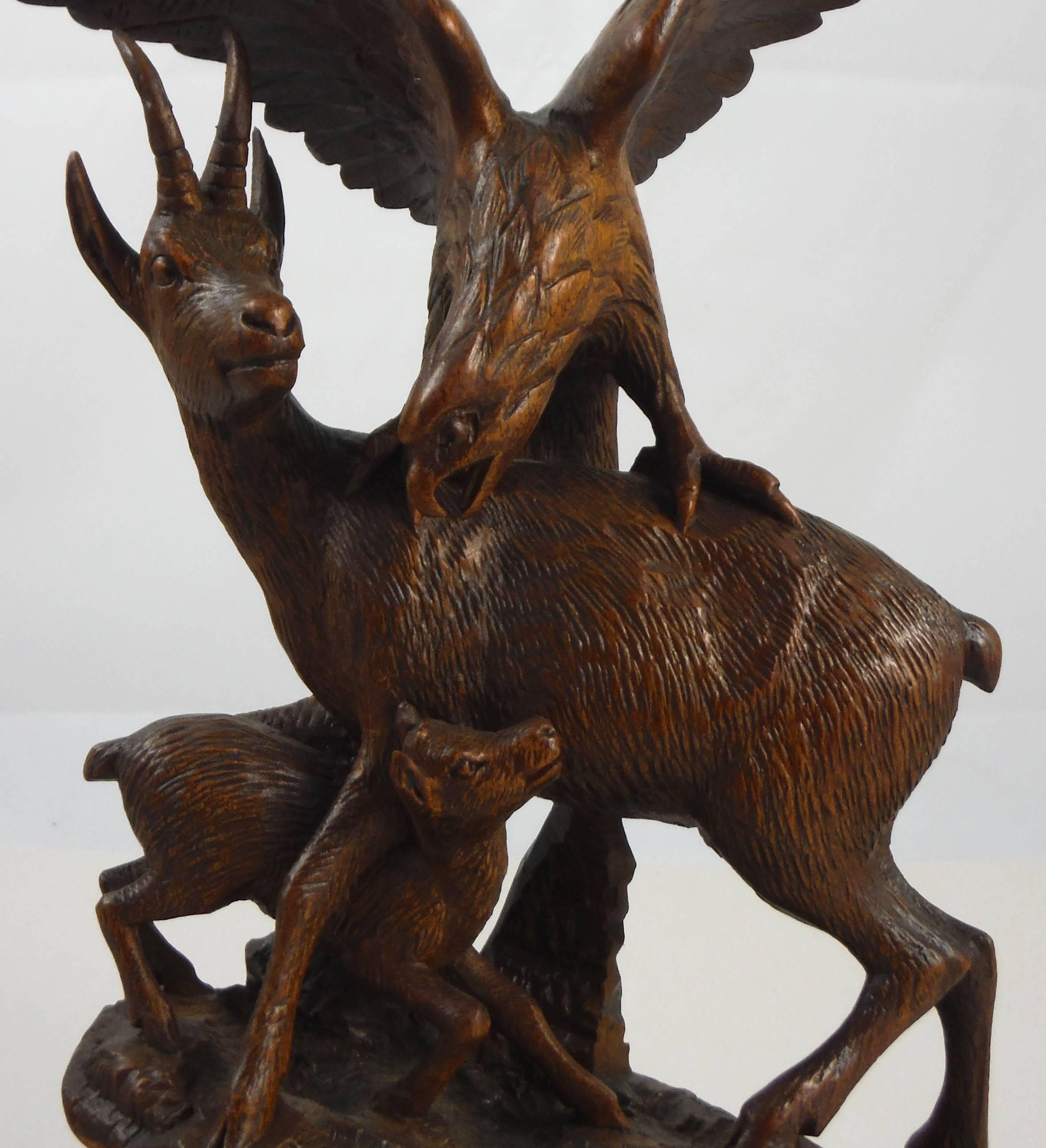 Antique fine 19th Black Forest carved wood chamois and eagle, circa 1880.