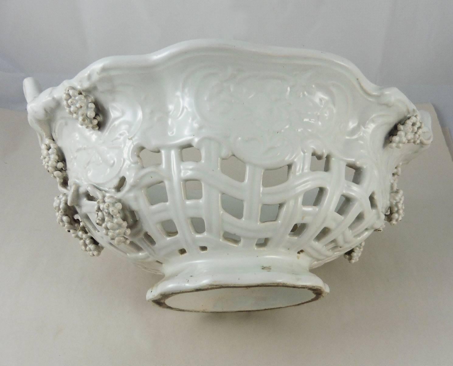 French white faience grapes-motif reticulated handled basket, circa 1900.