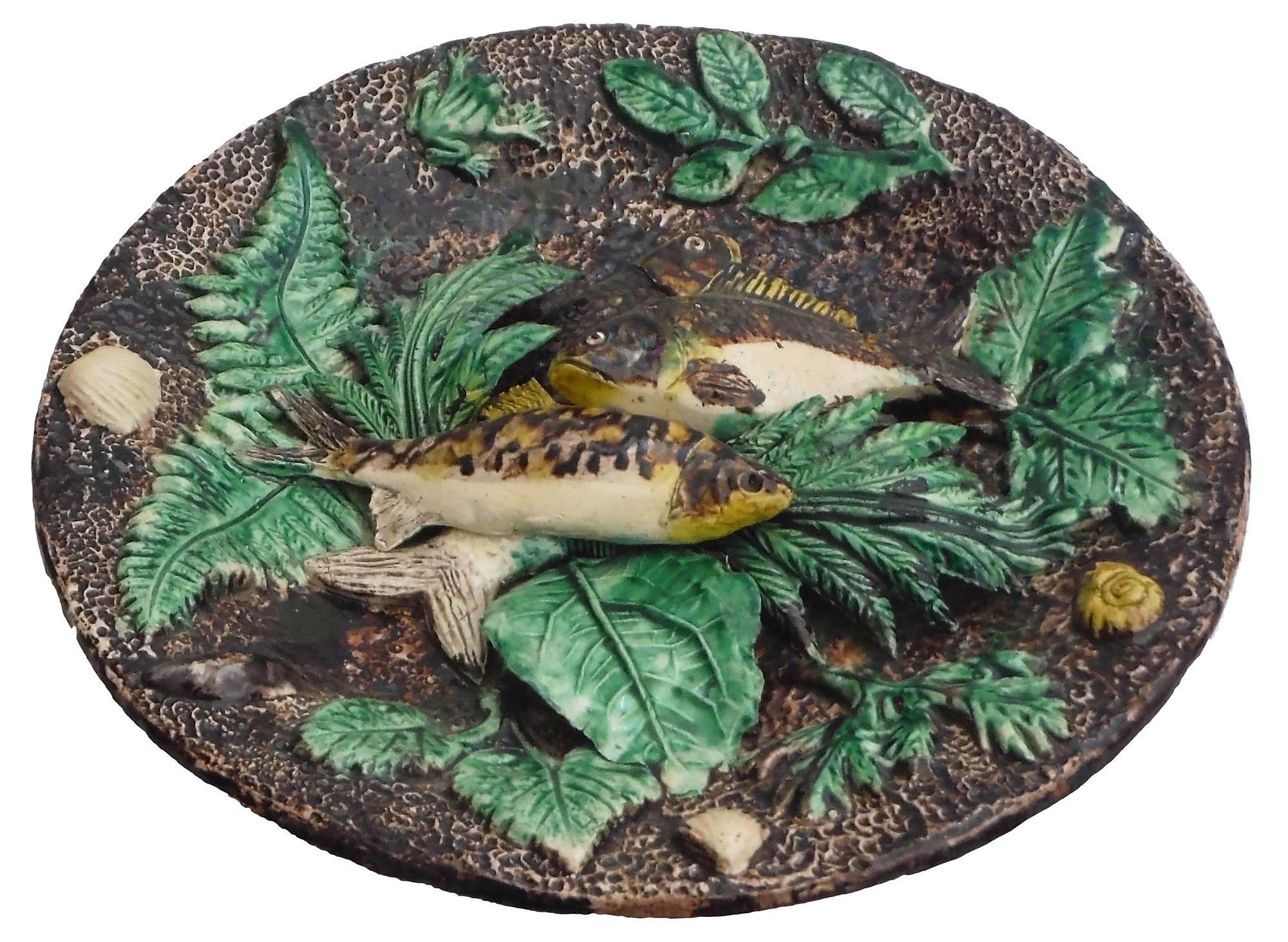 Antique French Majolica Palissy wall platter, circa 1880 with fish, frogs, shells, and green leaves, circa 1880.
Attributed to the ceramist Francois Maurice.
The school of Paris is composed by makers as Victor Barbizet, Francois Maurice, Thomas