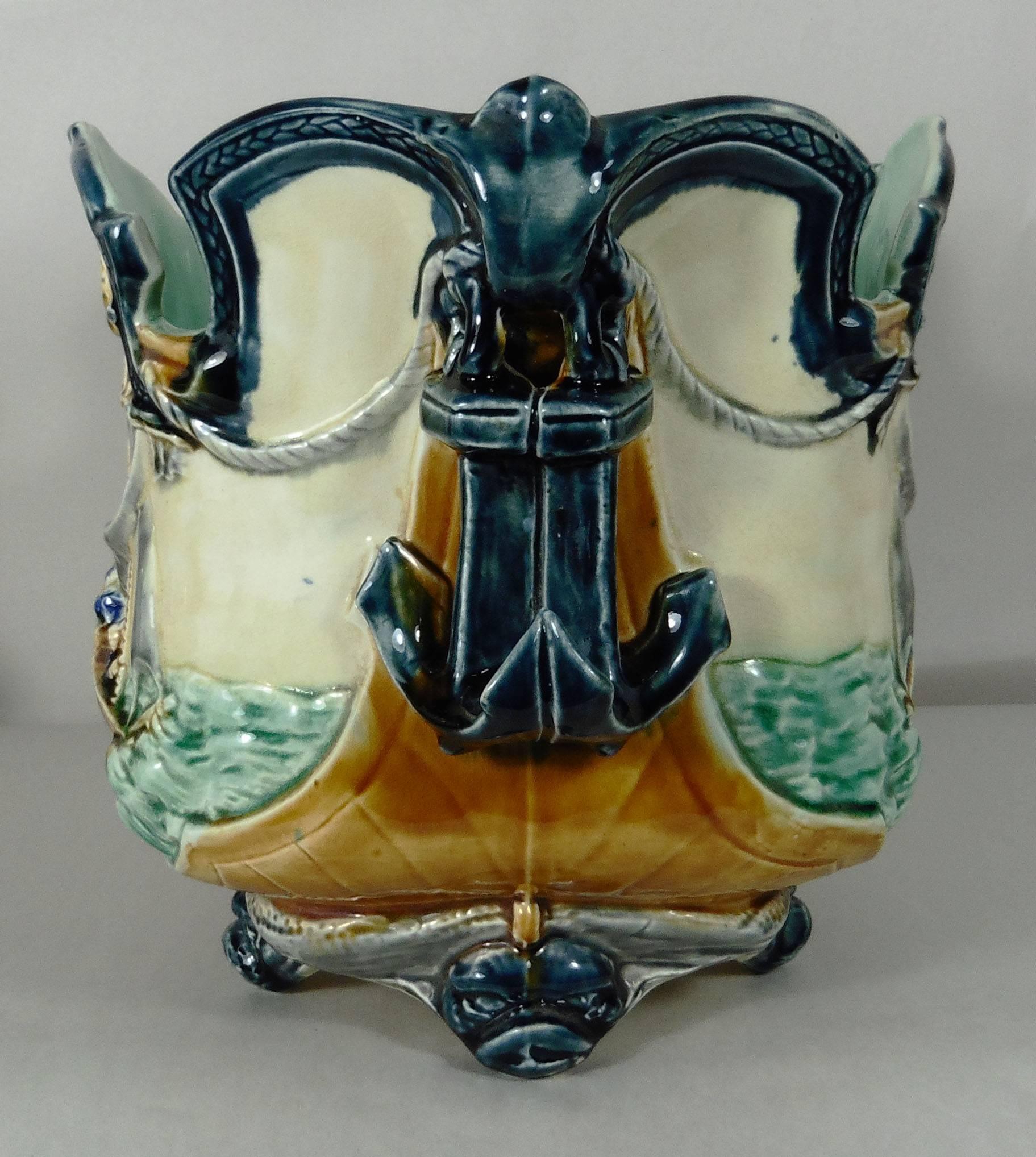 19th century, majolica nautical jardinière the two handles are anchors signed Onnaing, the feets are dolphins and the front are decorated with boats on the sea.