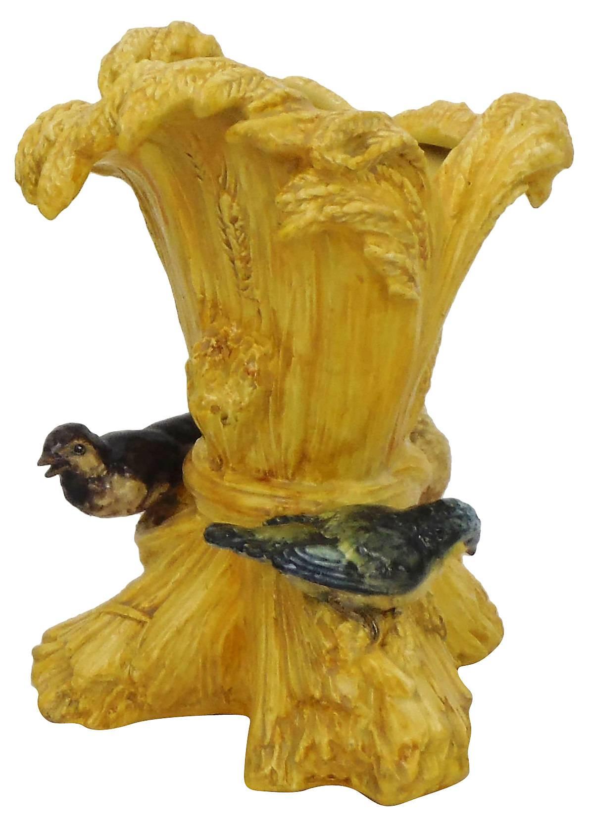 19th century large Majolica sheaf of wheat vase with birds around the vase signed Delphin Massier.
The Massier are known for the quality of their unique enamels and paintings. The Massier family produced different pieces with birds in a very