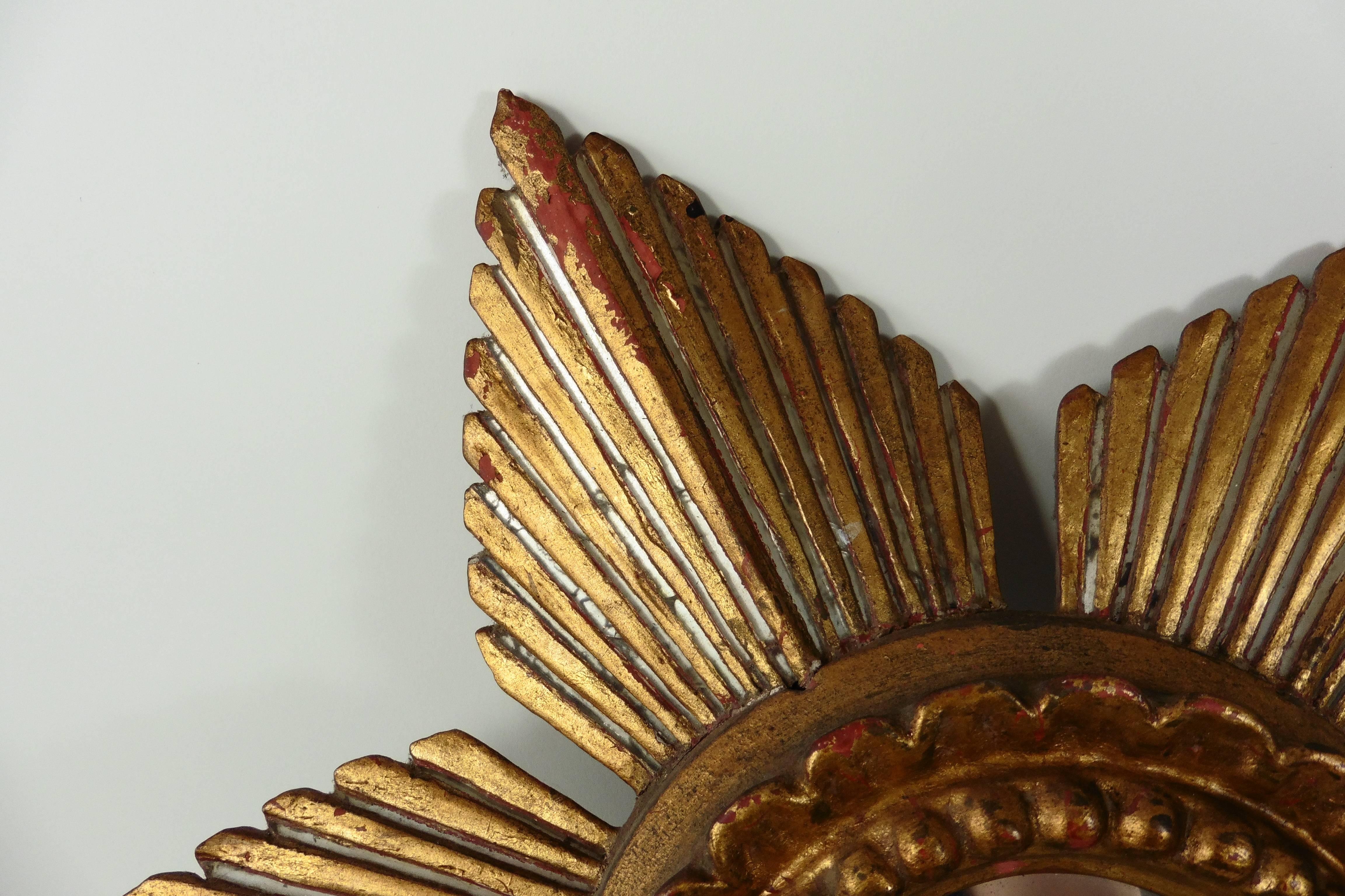 Unusual French gilded sunburst or star with six branches mirror, silver lines between the gilding circa 1940. Missing gilding, wears.