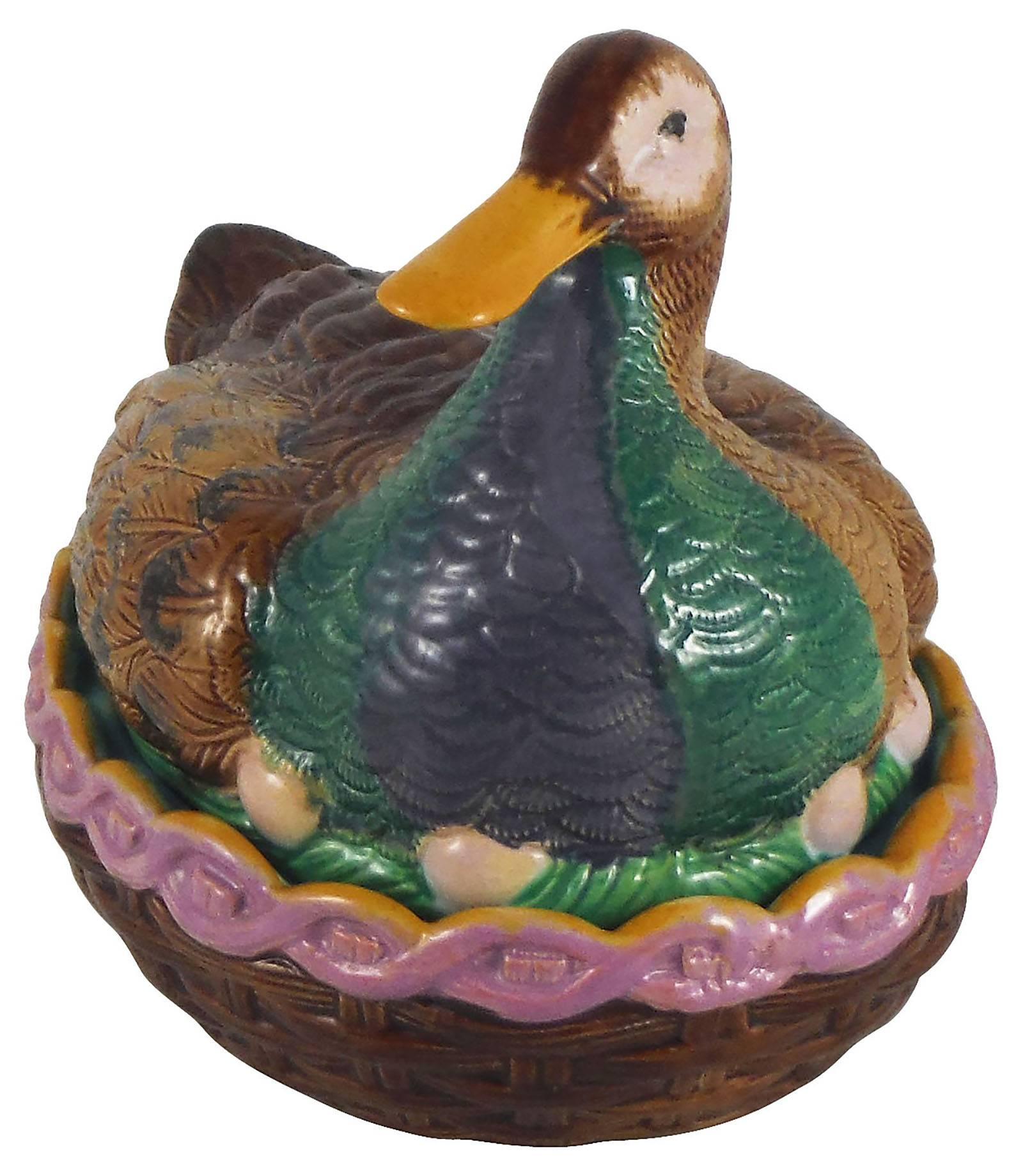 Rare 19th Century English Majolica duck on nest tureen attributed to William Brownfield.
The duck is brown, green and grey, the interior of the tureen is aqua turquoise like several English pieces.
This is a rare example of tureen made by William